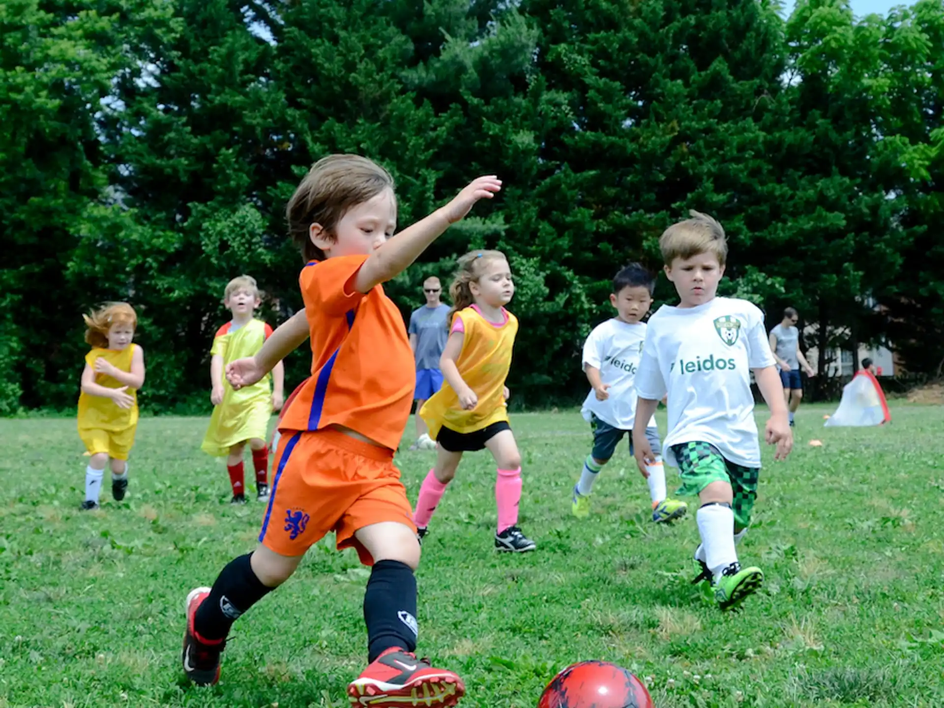 kids playing football on a field