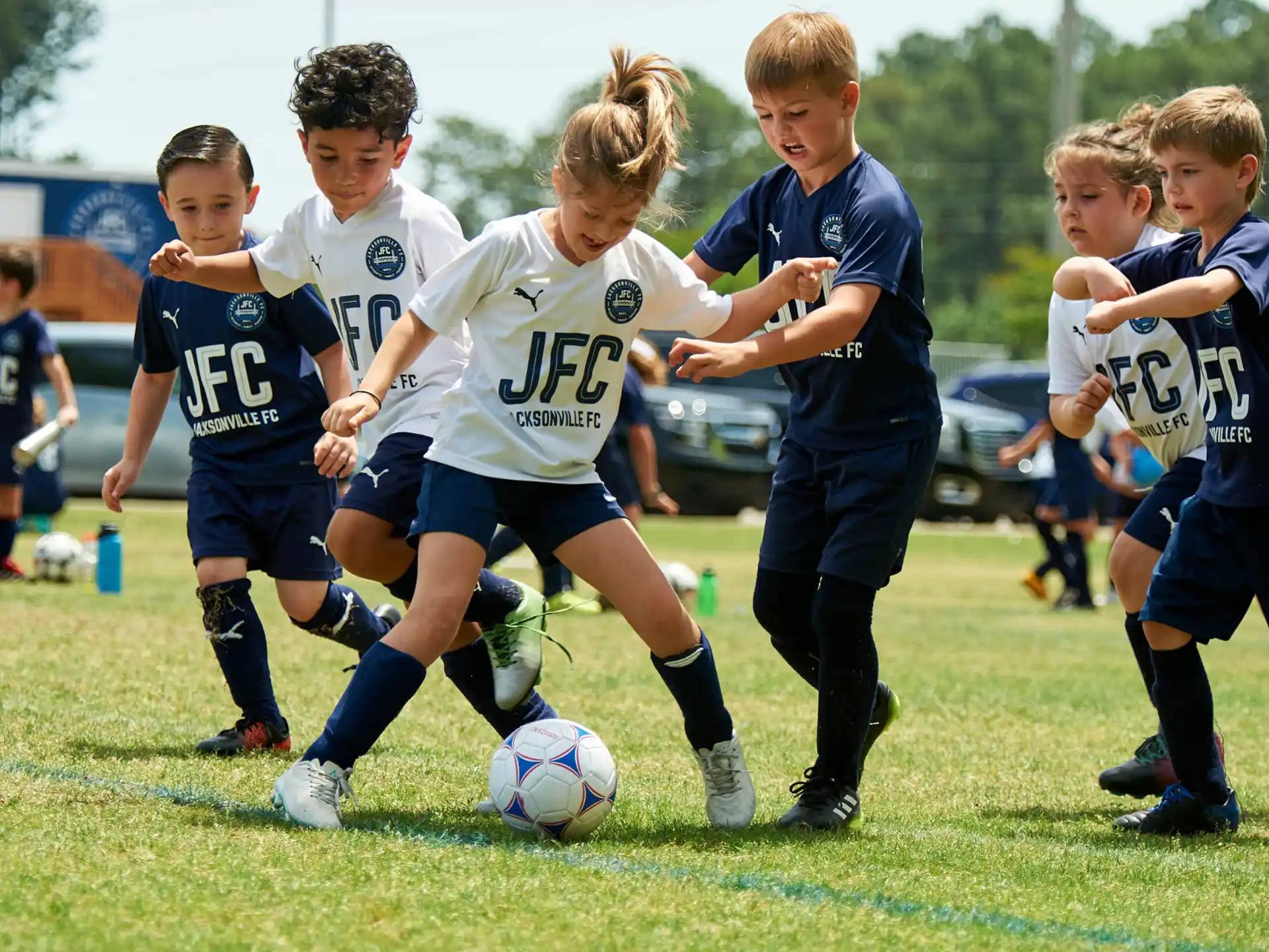 kids playing football on a field