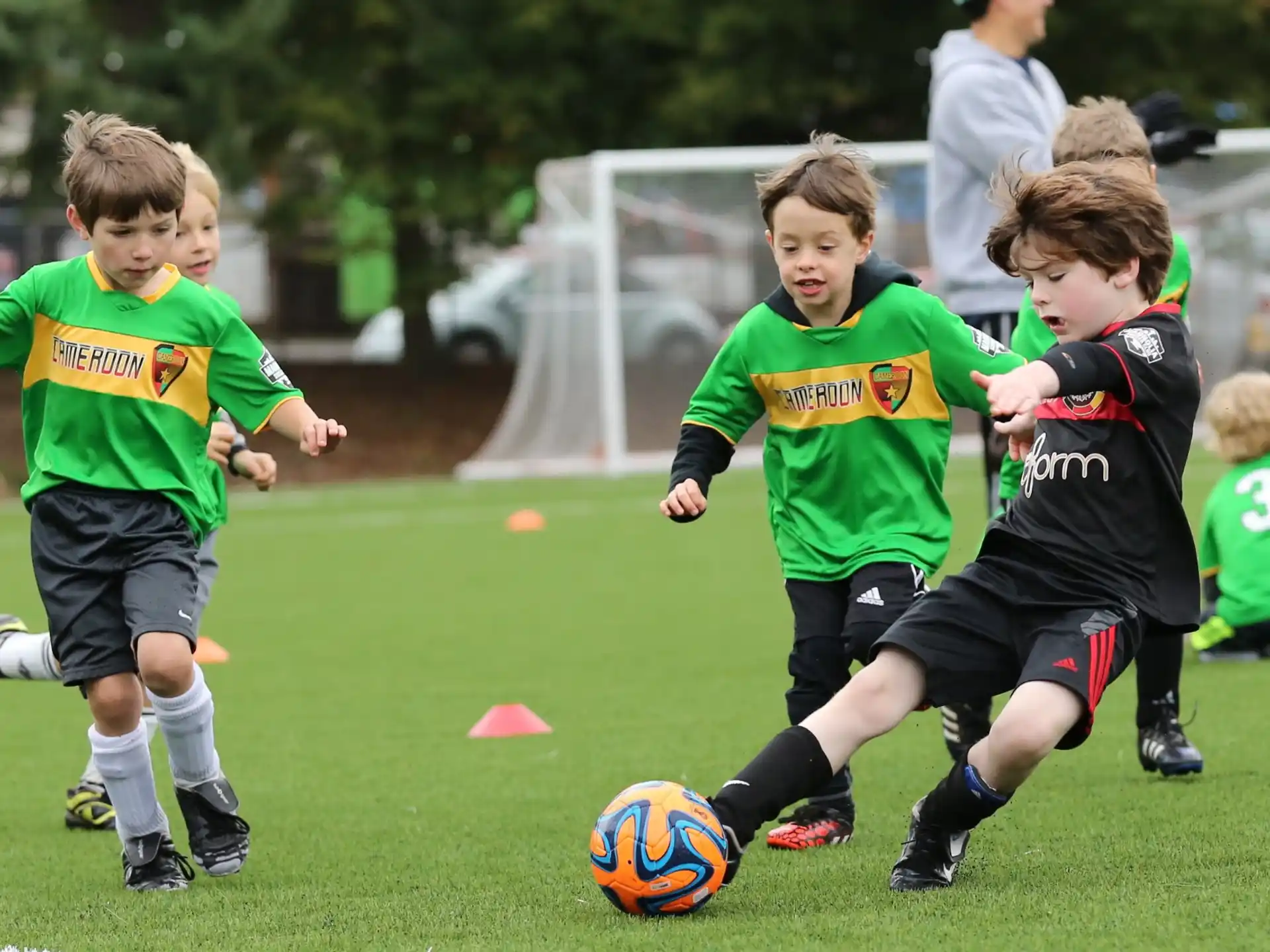 kids playing football on a field