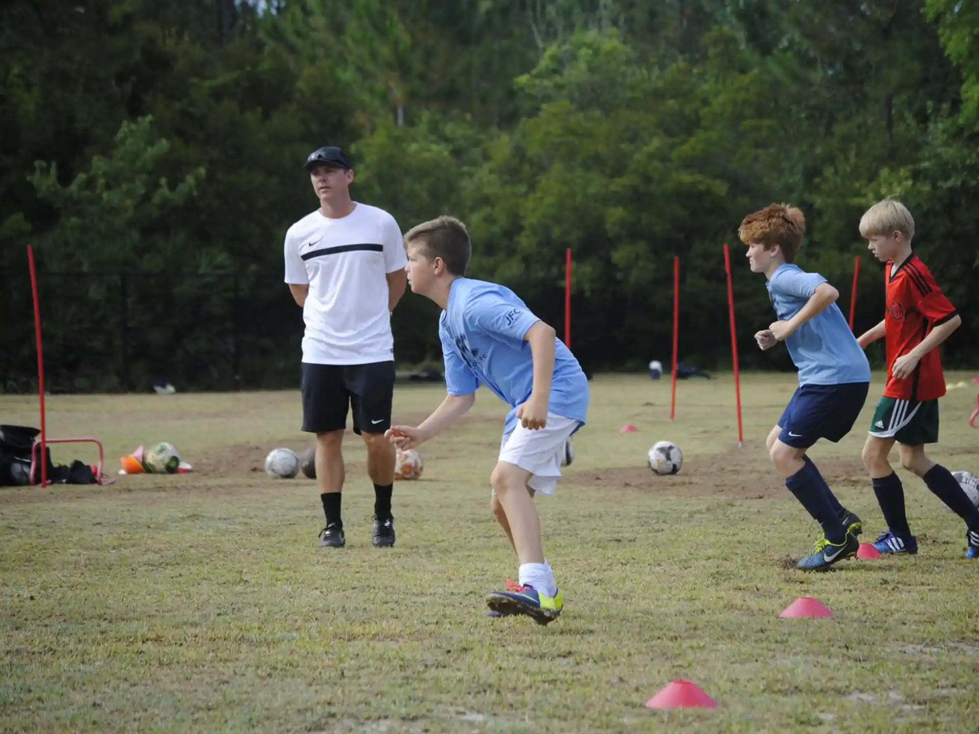 a group of kids playing football