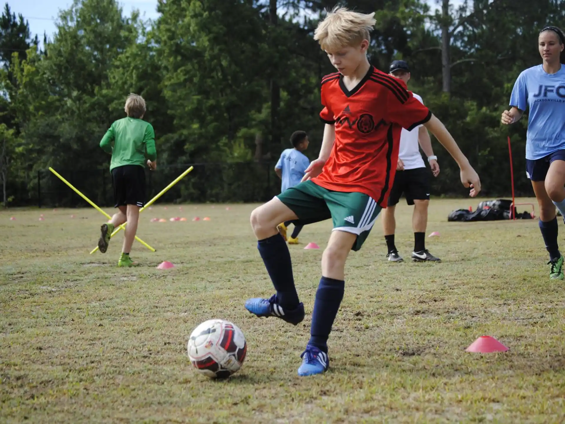 a group of kids playing football
