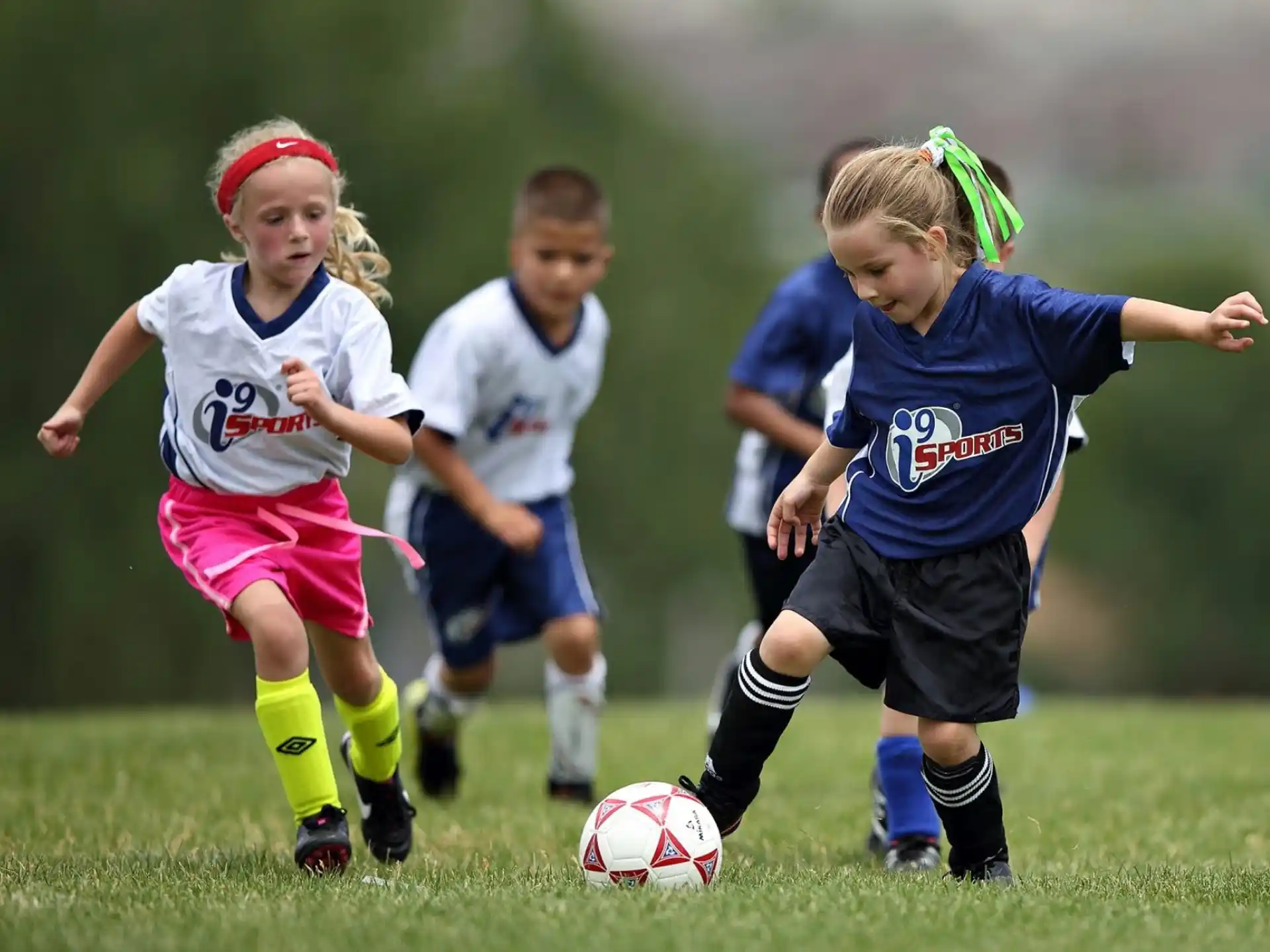a group of young girls playing football