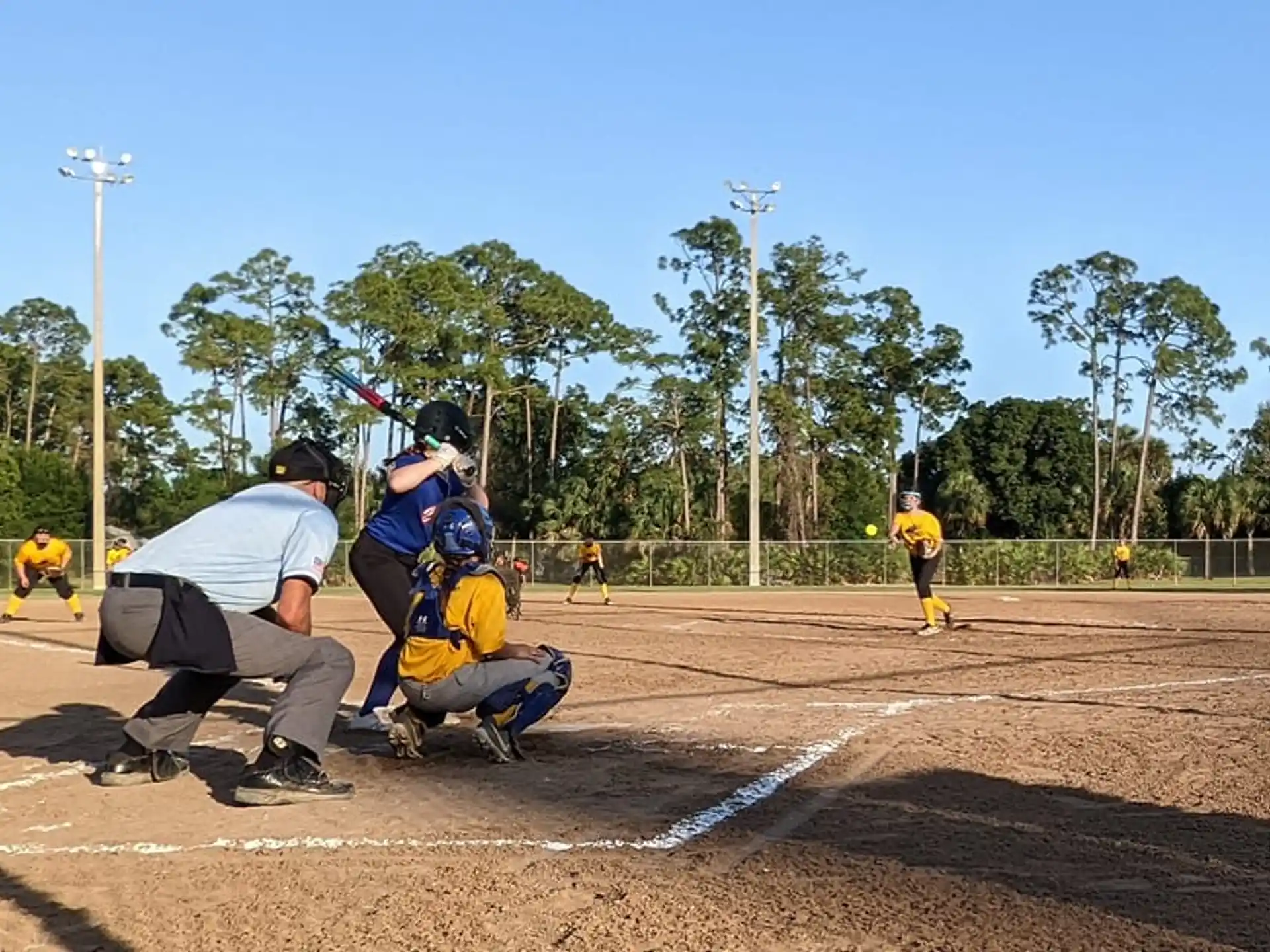 a group of people playing baseball