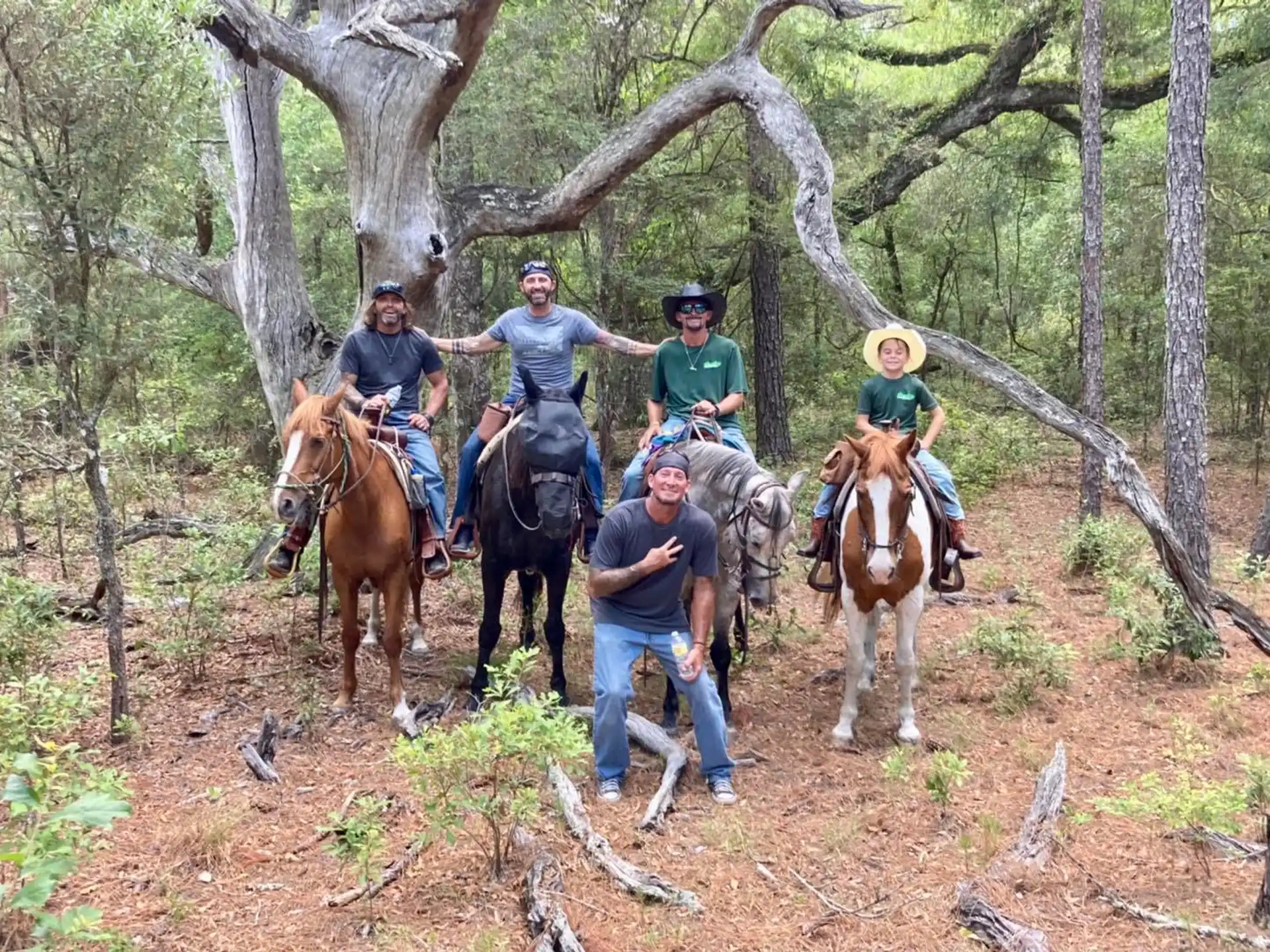 a group of people riding horses
