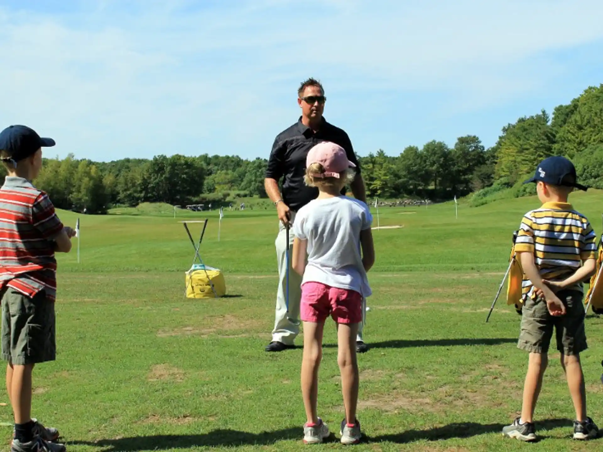 a group of people on a golf course