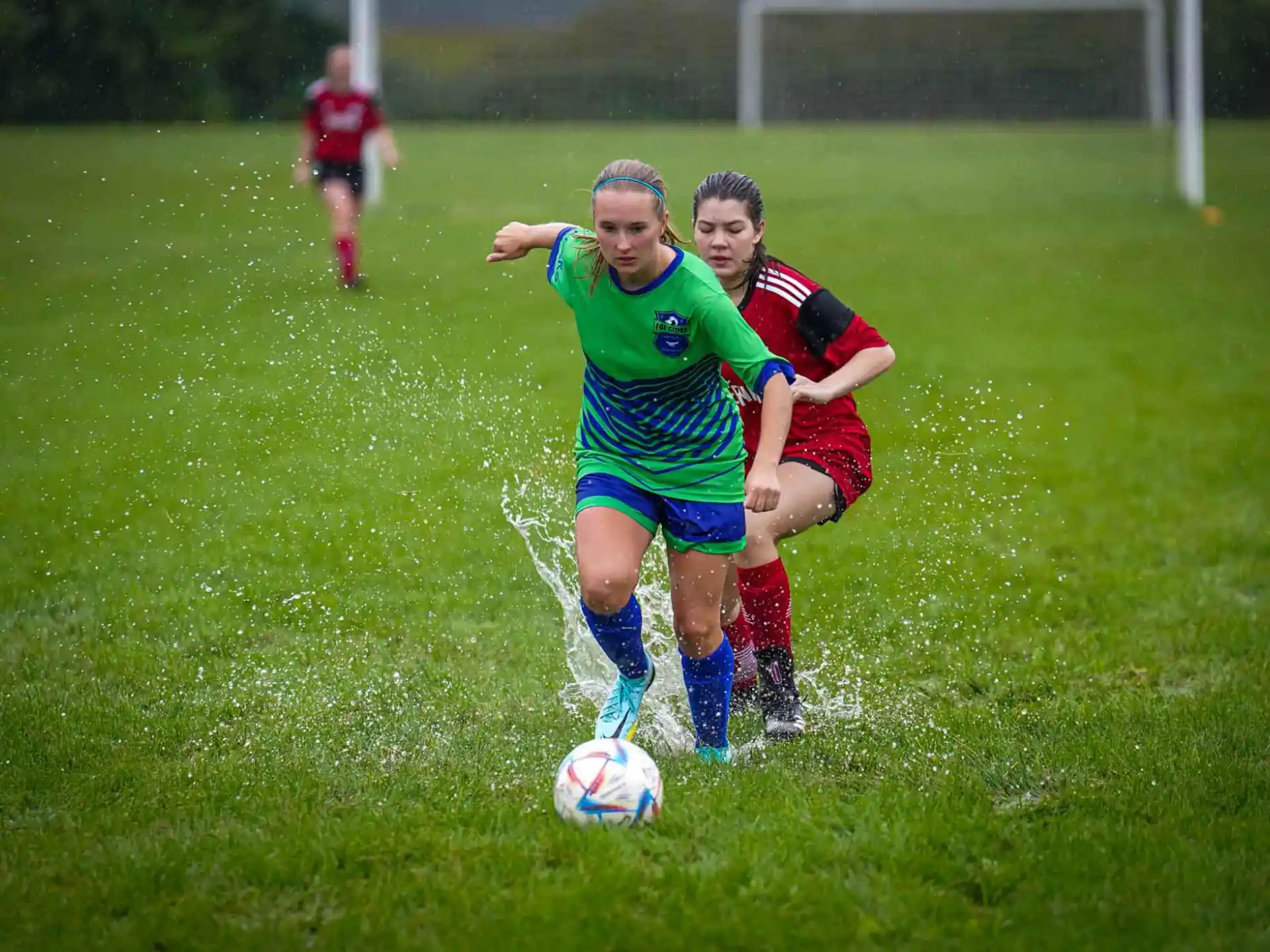 a couple of girls playing football