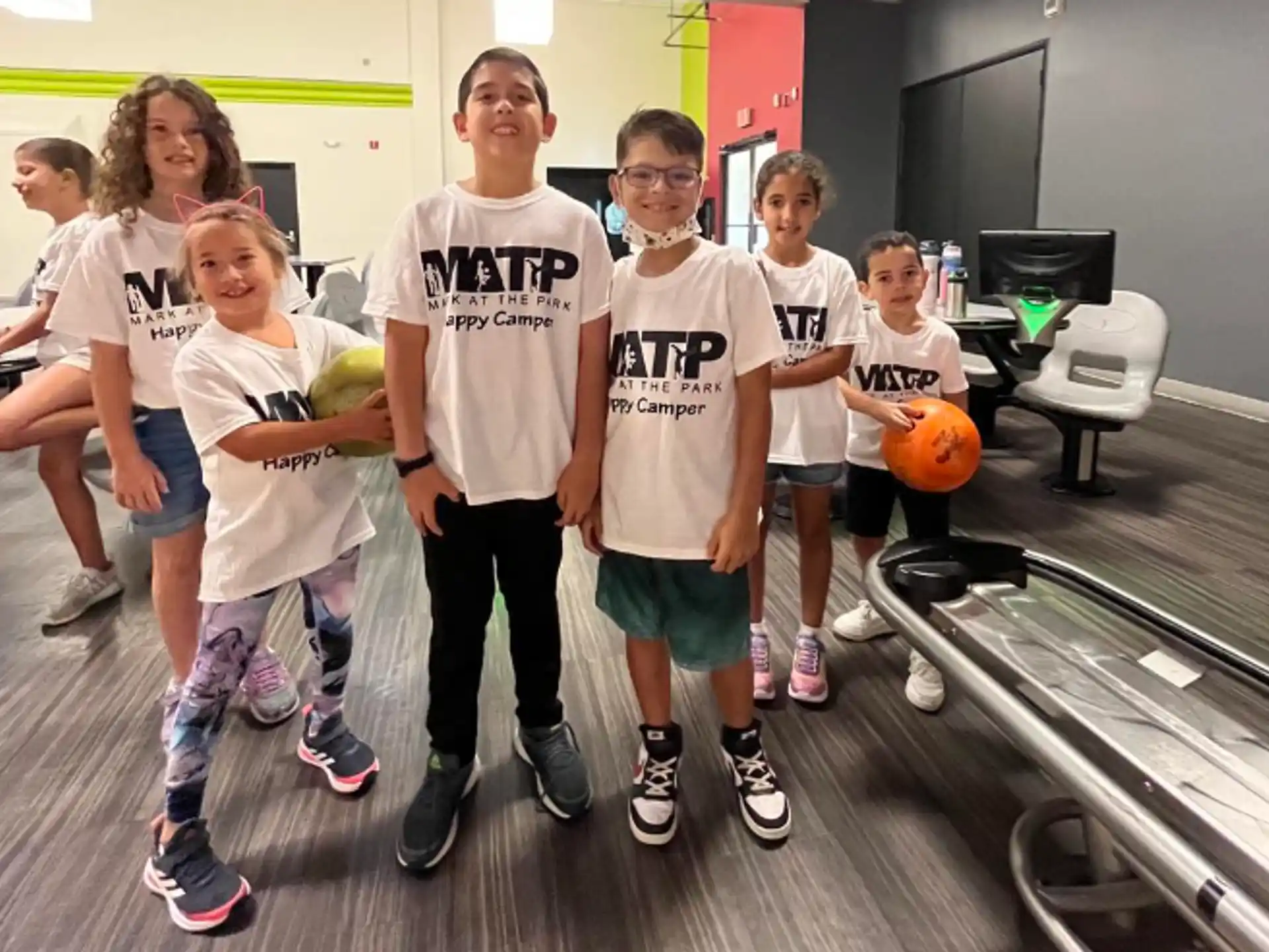 a group of kids posing for a photo