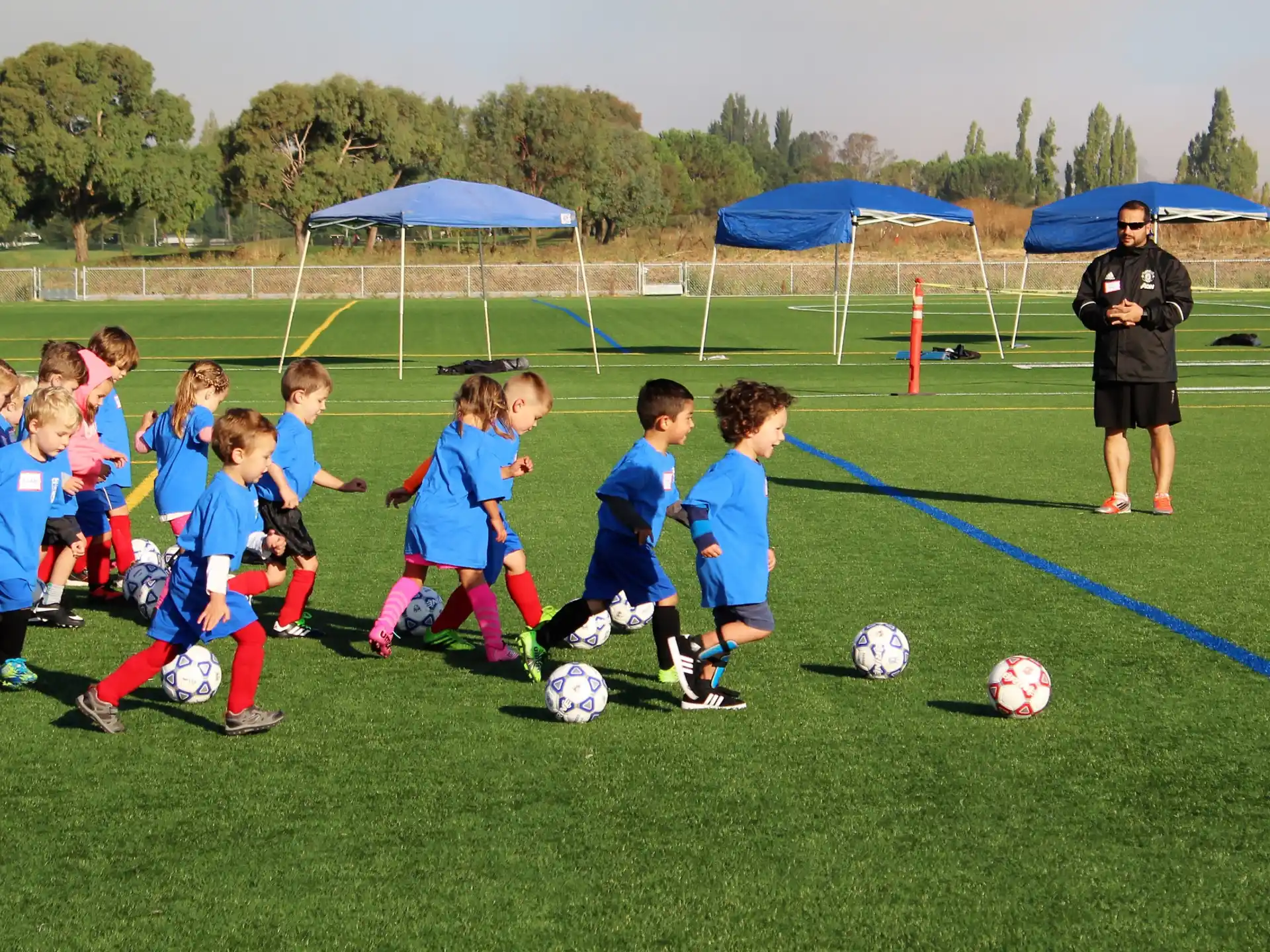 a group of kids playing football