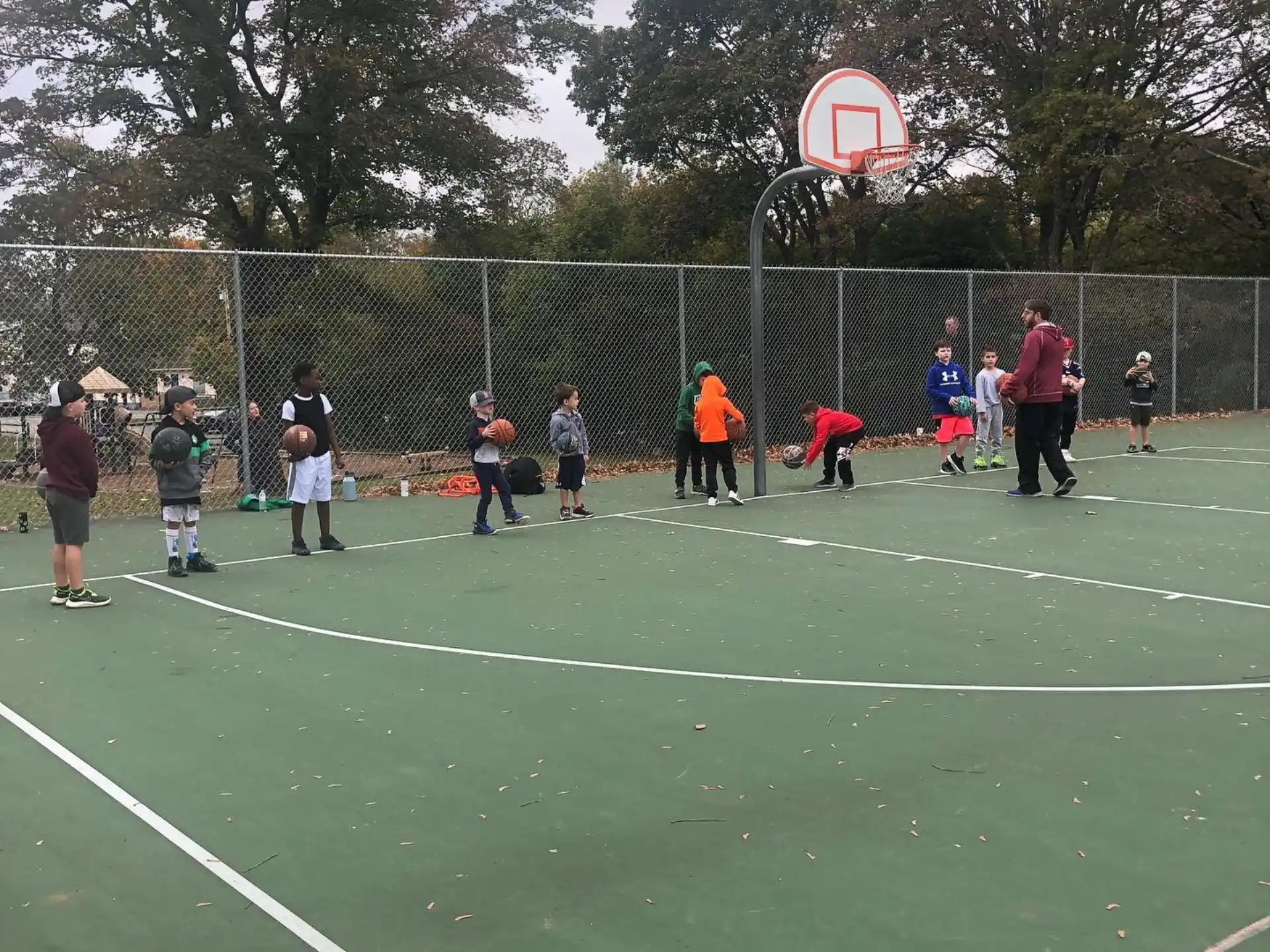 a group of people playing basketball