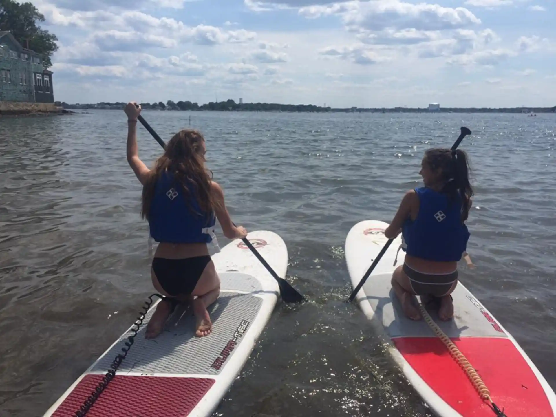 a couple of girls on a boat