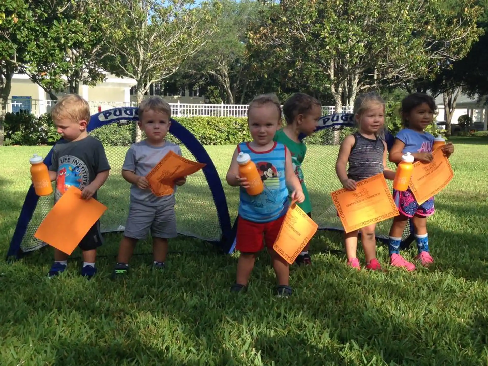 a group of children holding toys