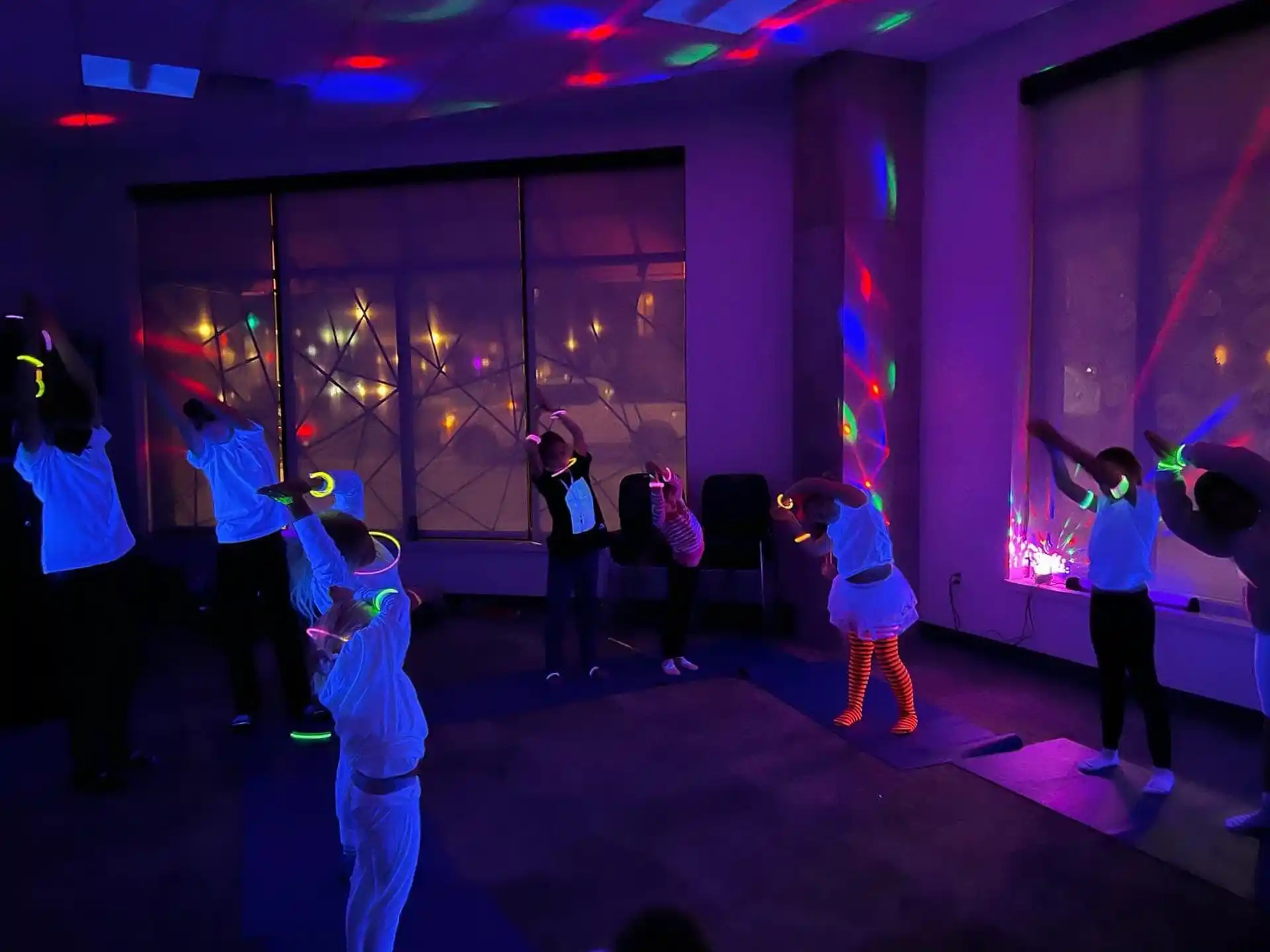 a group of people dancing on a stage