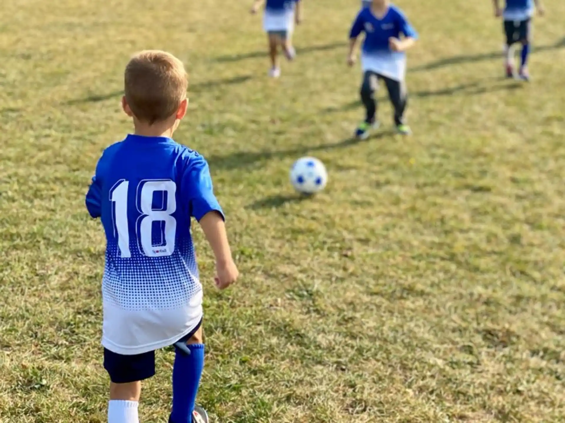 a kid playing football