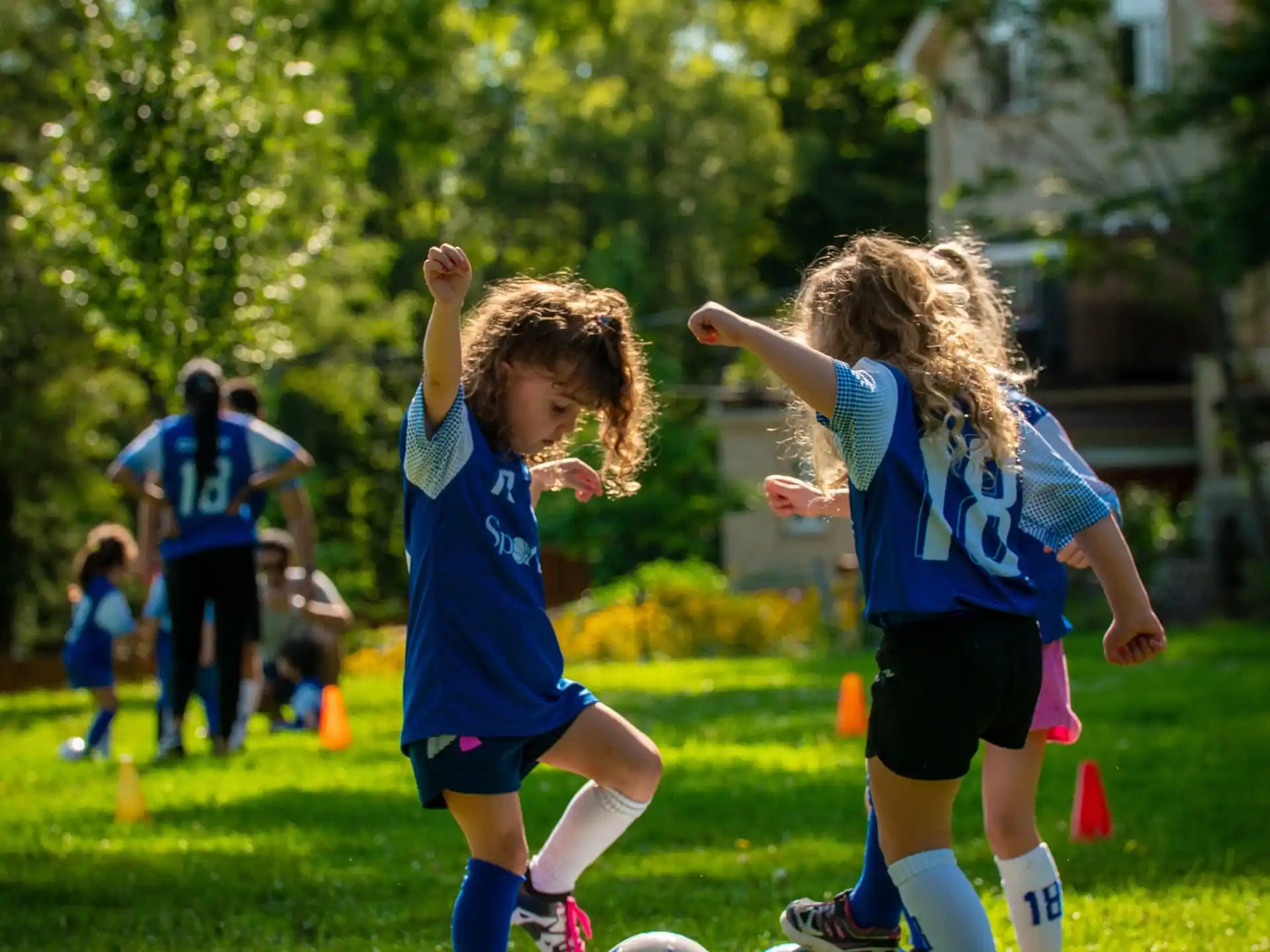 kids playing football on a field