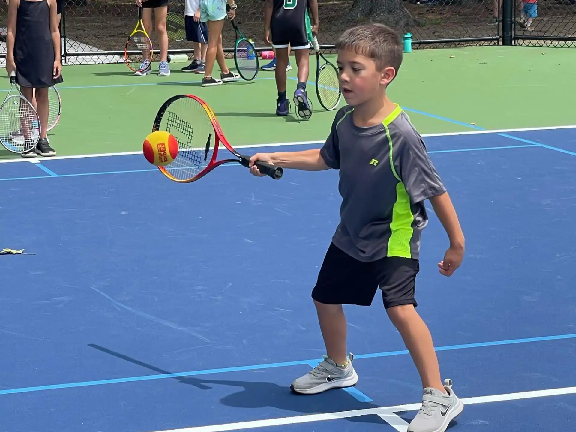 a boy playing tennis