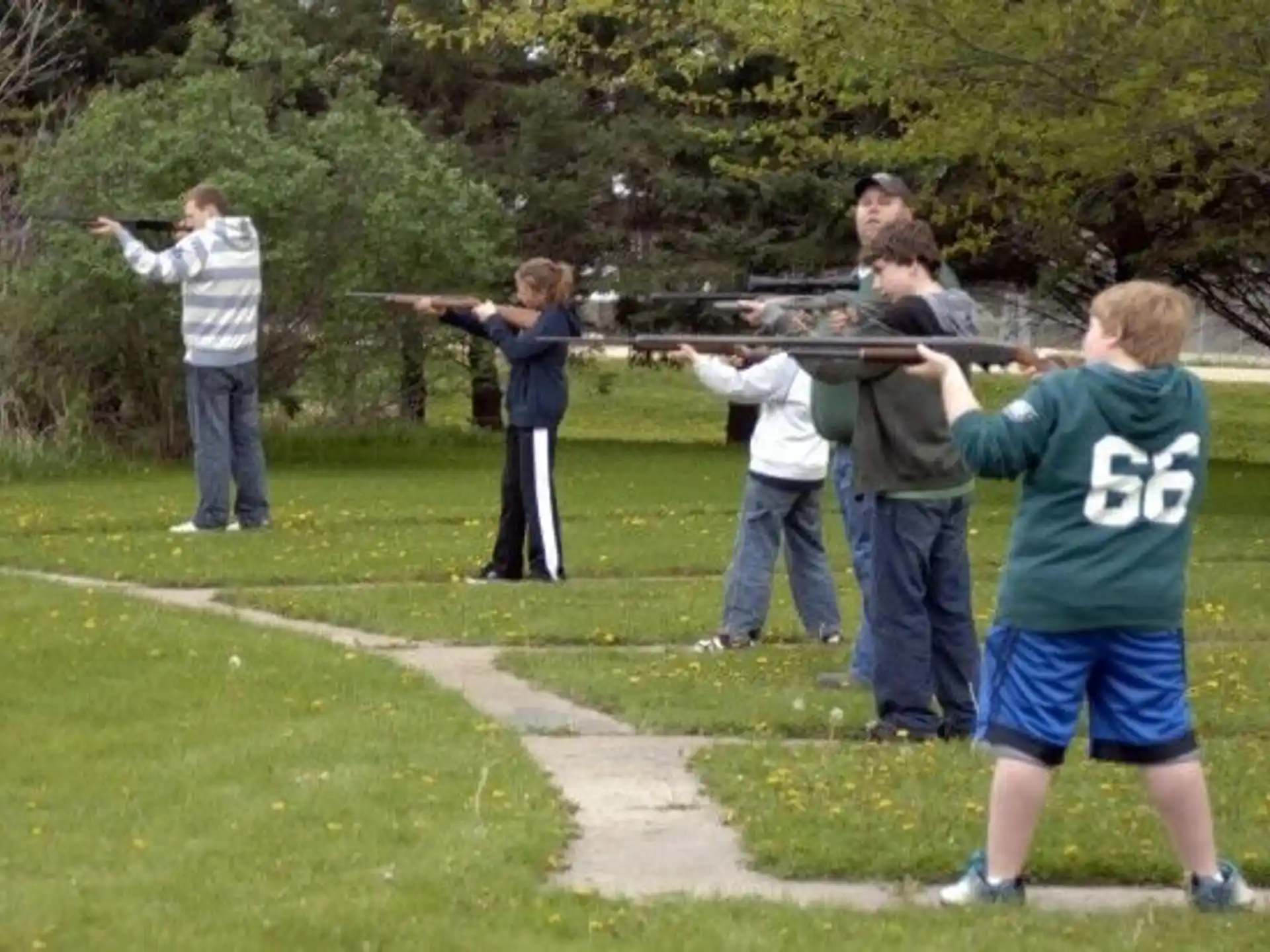 a group of people holding a large sword