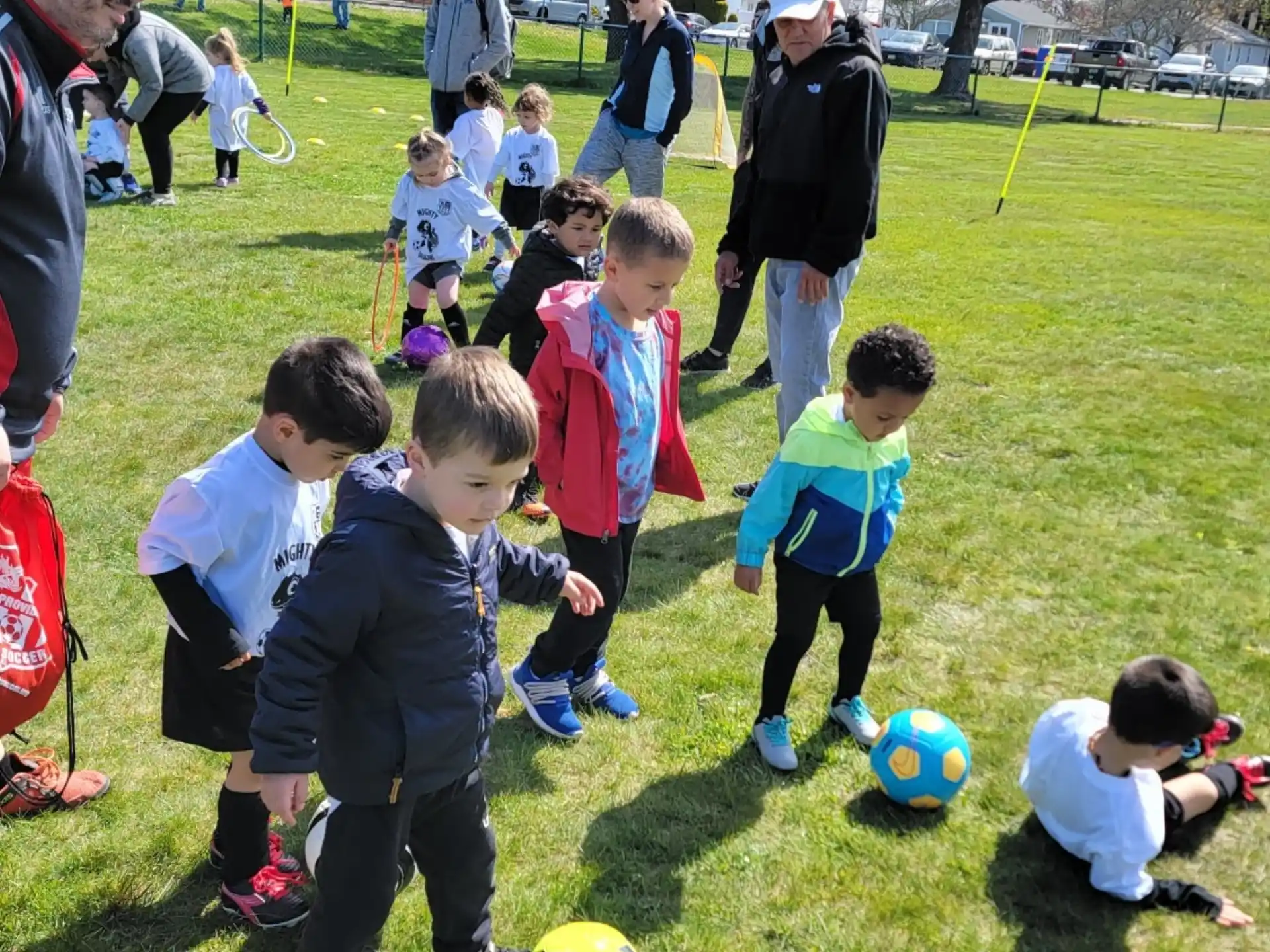 a group of kids playing football