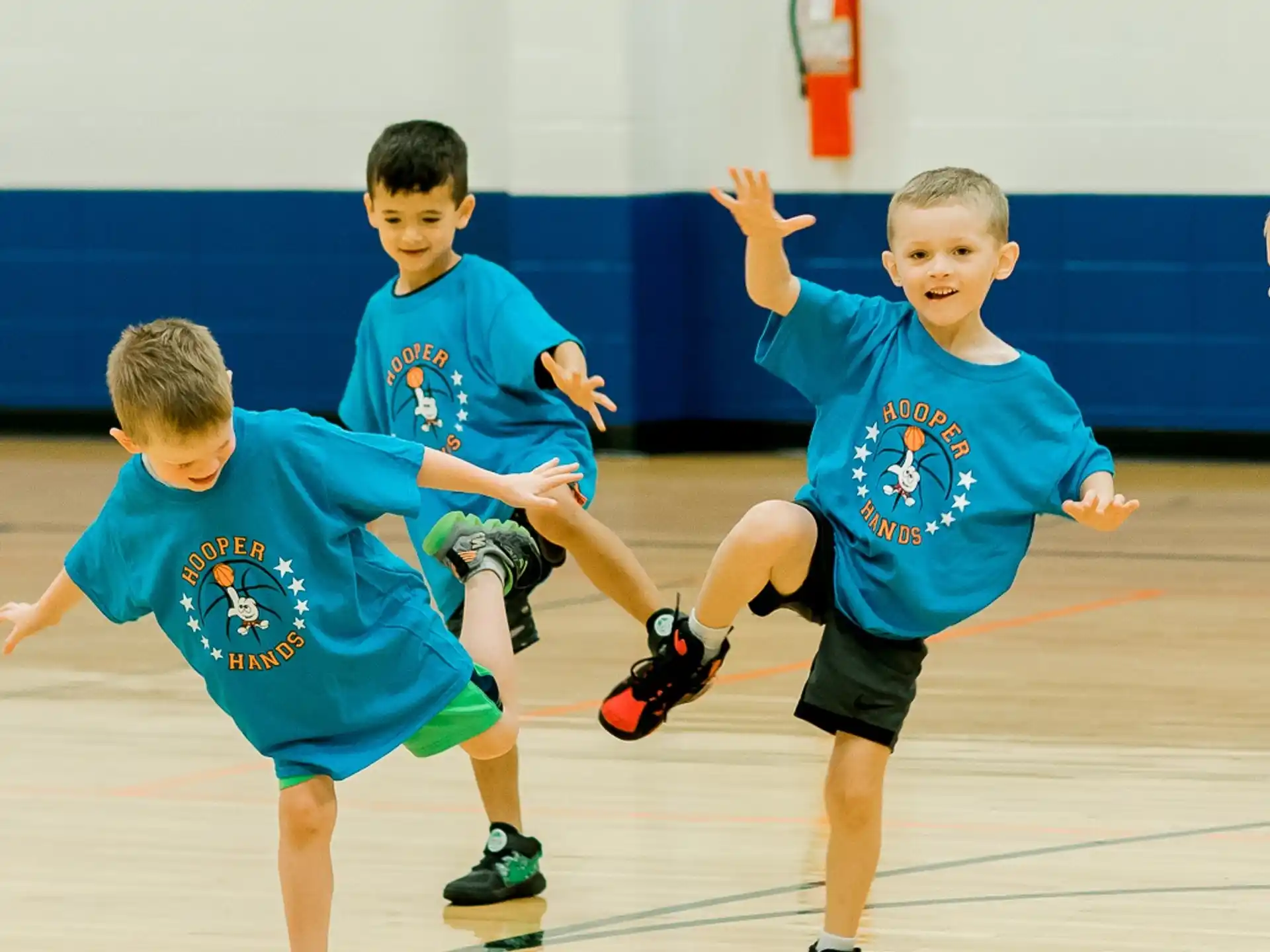 a group of boys playing basketball
