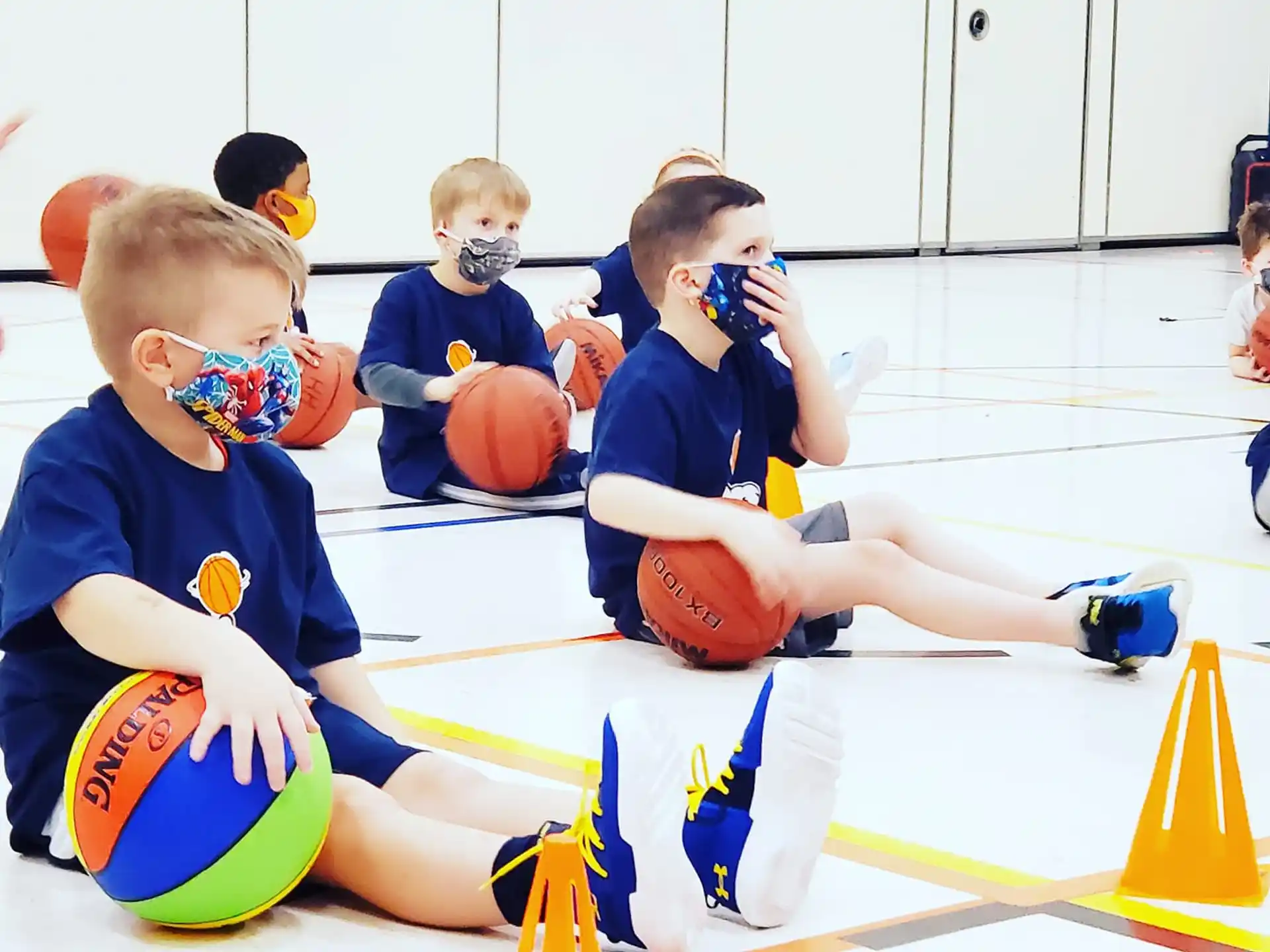 a group of boys playing basketball