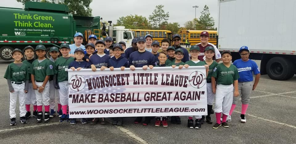 a group of people holding a sign