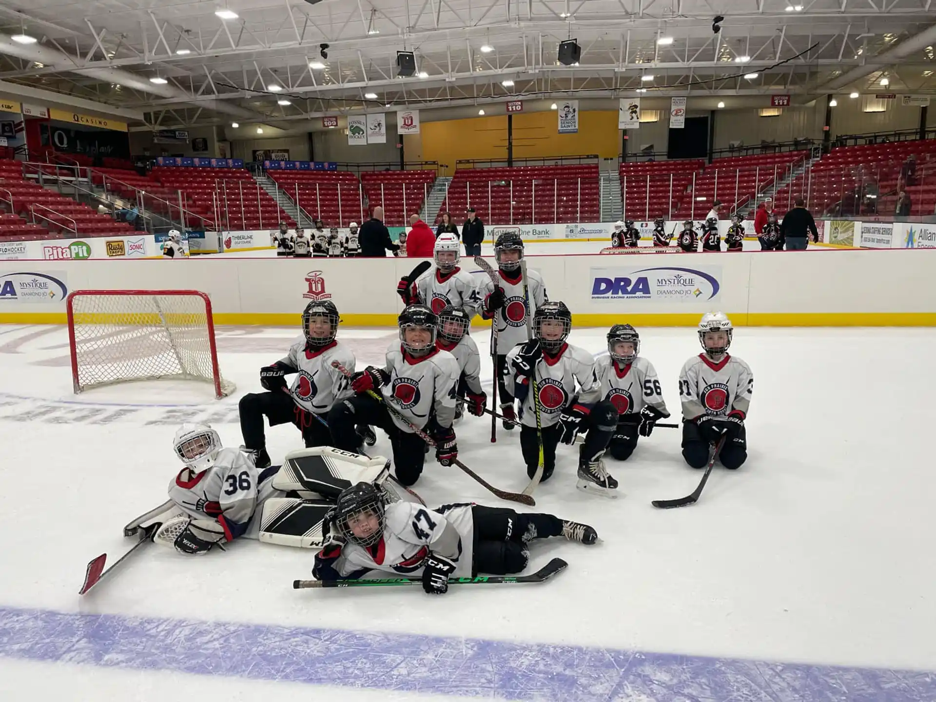 a group of hockey players posing for a photo