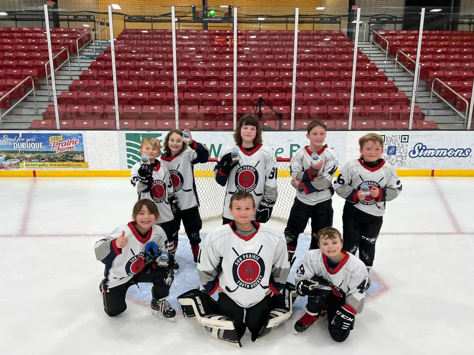 a group of people wearing hockey uniforms