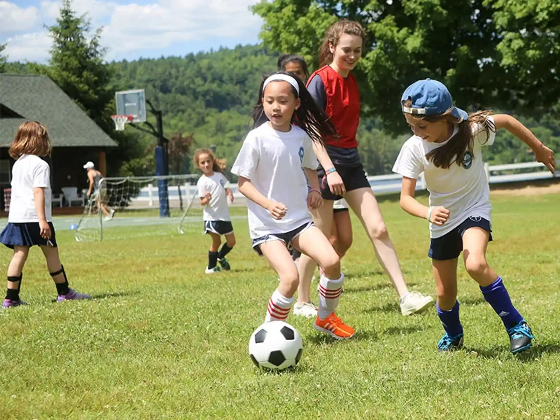 a group of girls playing football