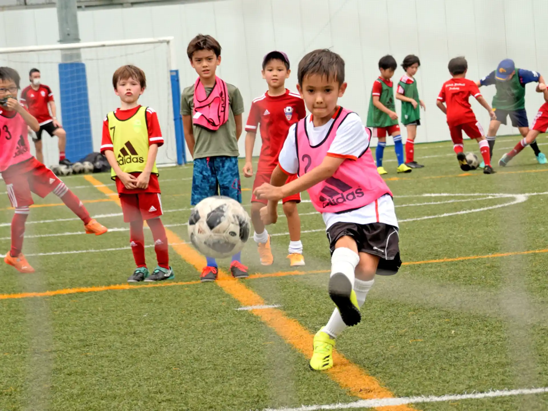 a group of kids playing football