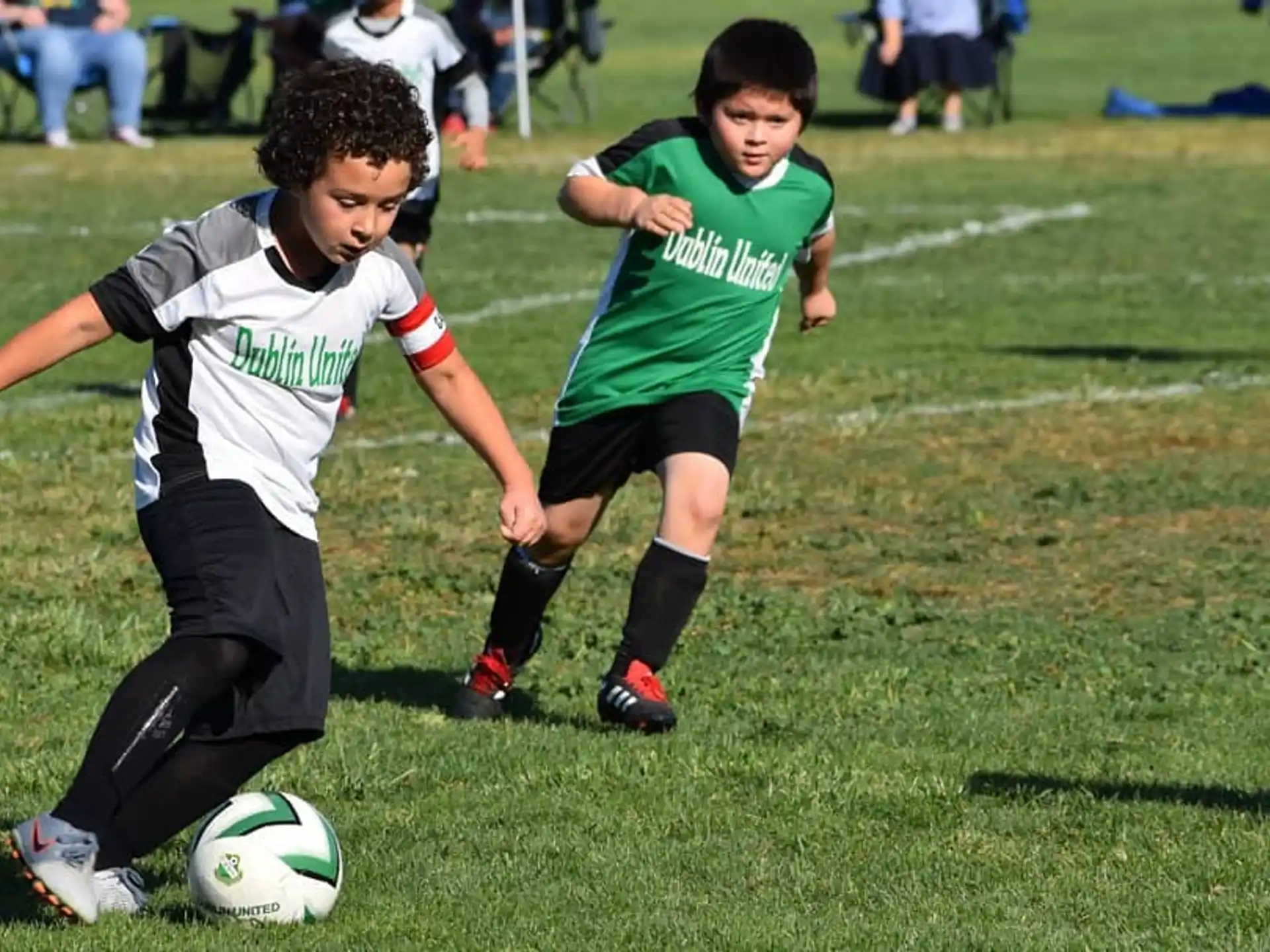 kids playing football on a field