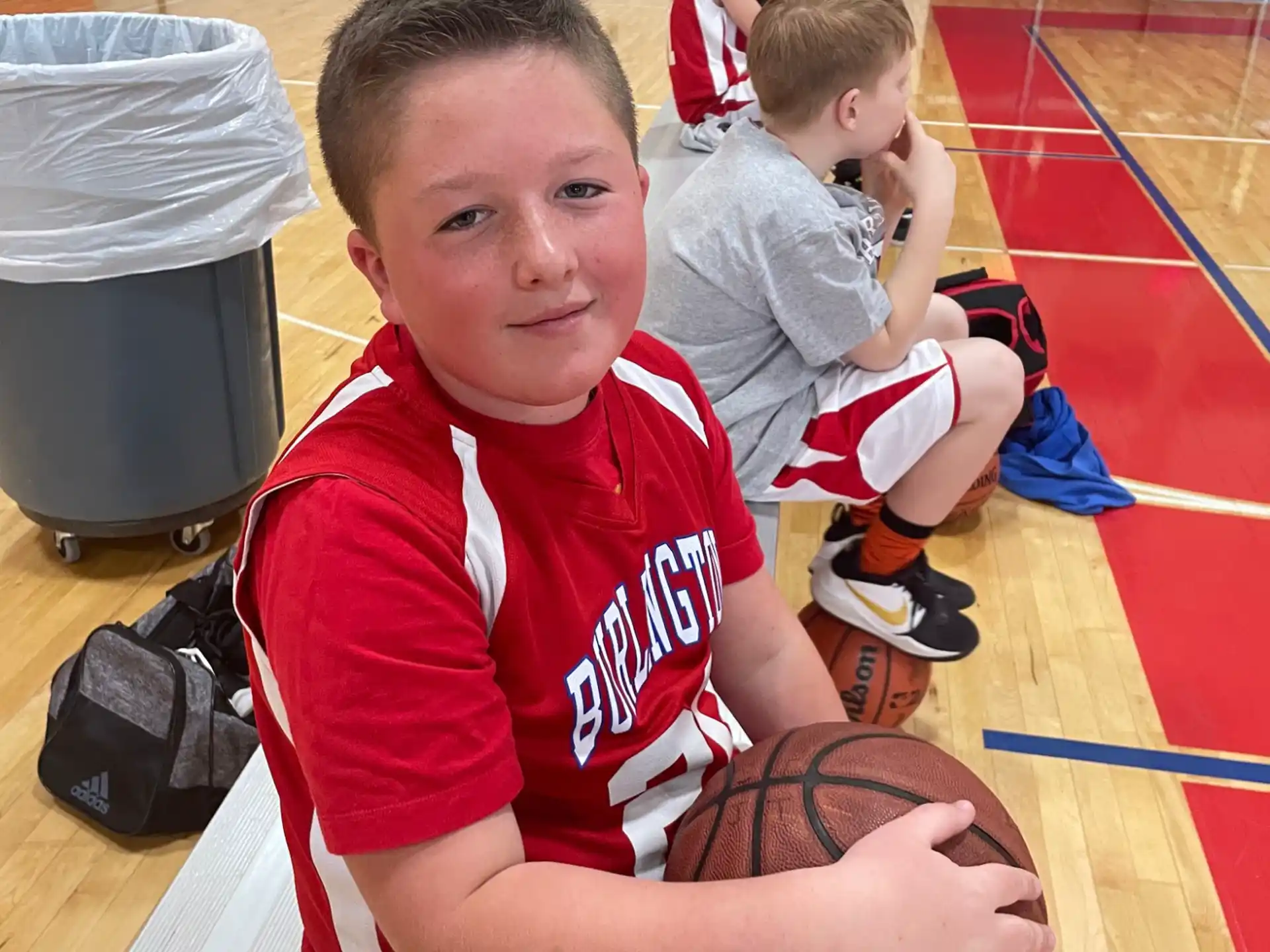 a boy holding a basketball