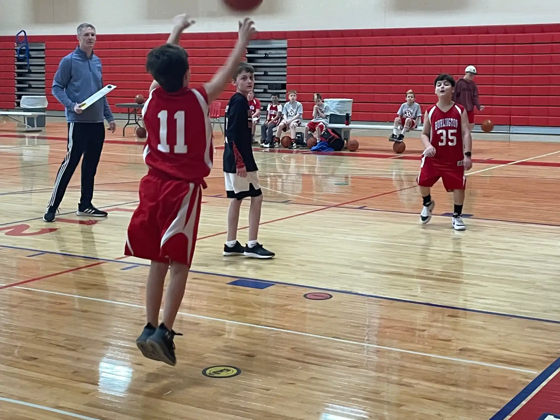 a group of people playing basketball