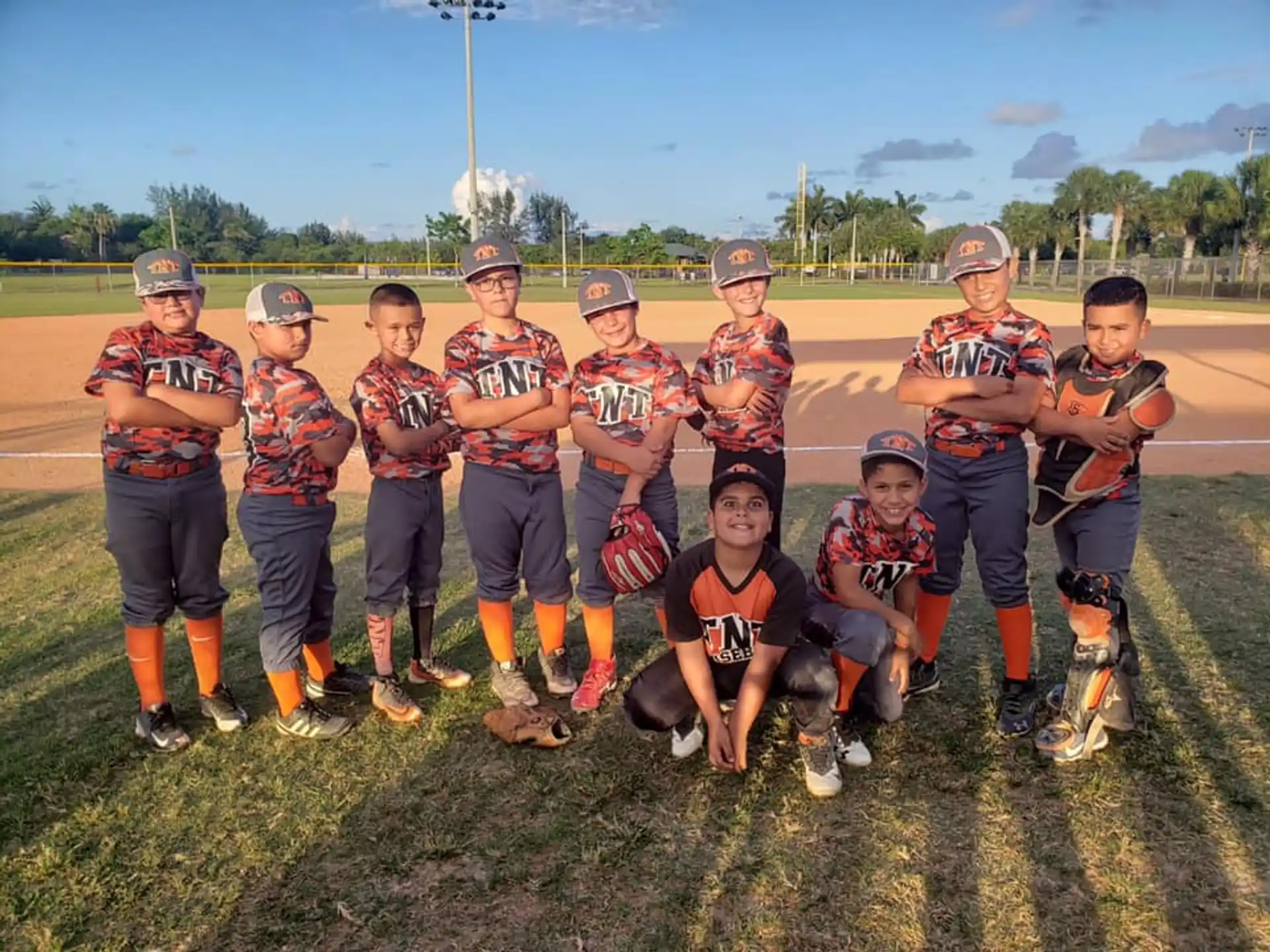 a group of kids wearing baseball uniforms