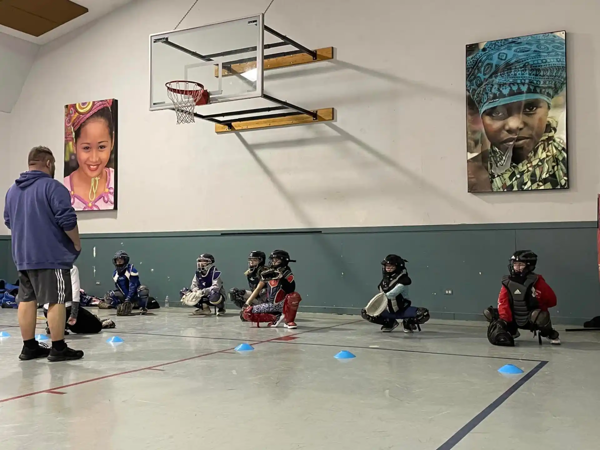 a group of people playing basketball