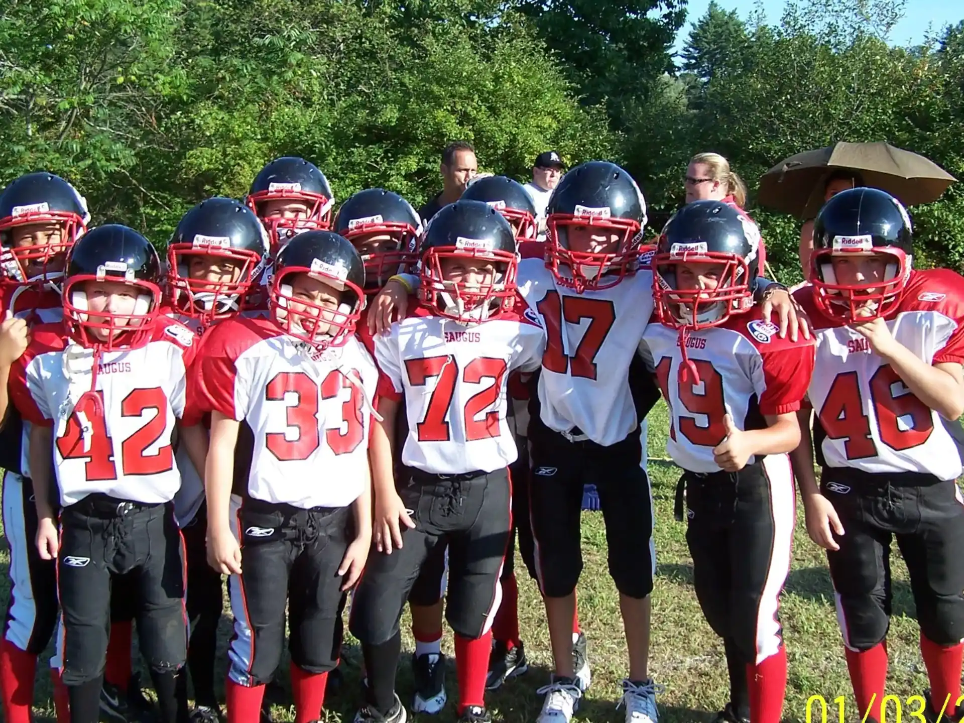 a group of kids wearing football gear