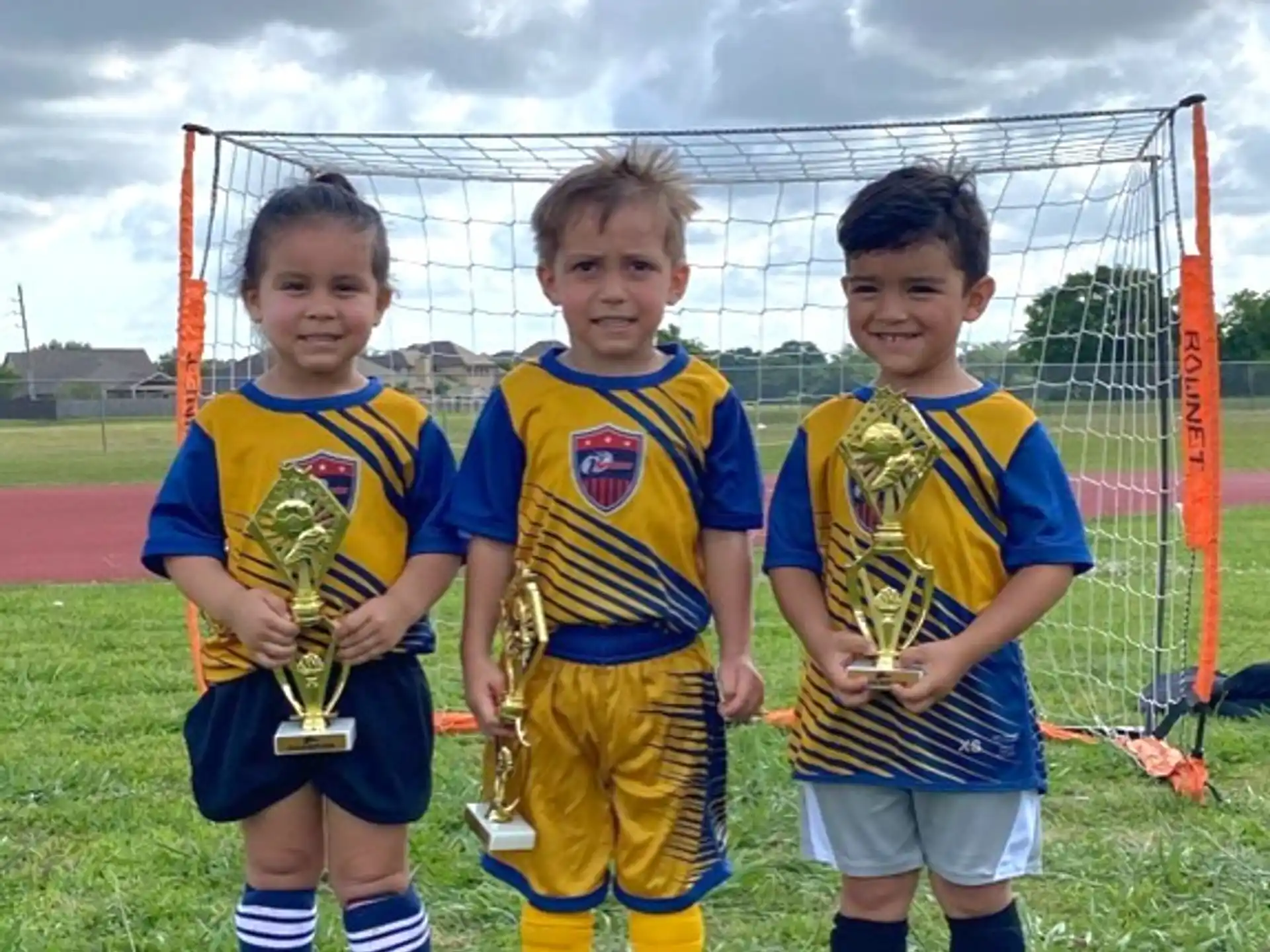 a group of kids in football uniforms