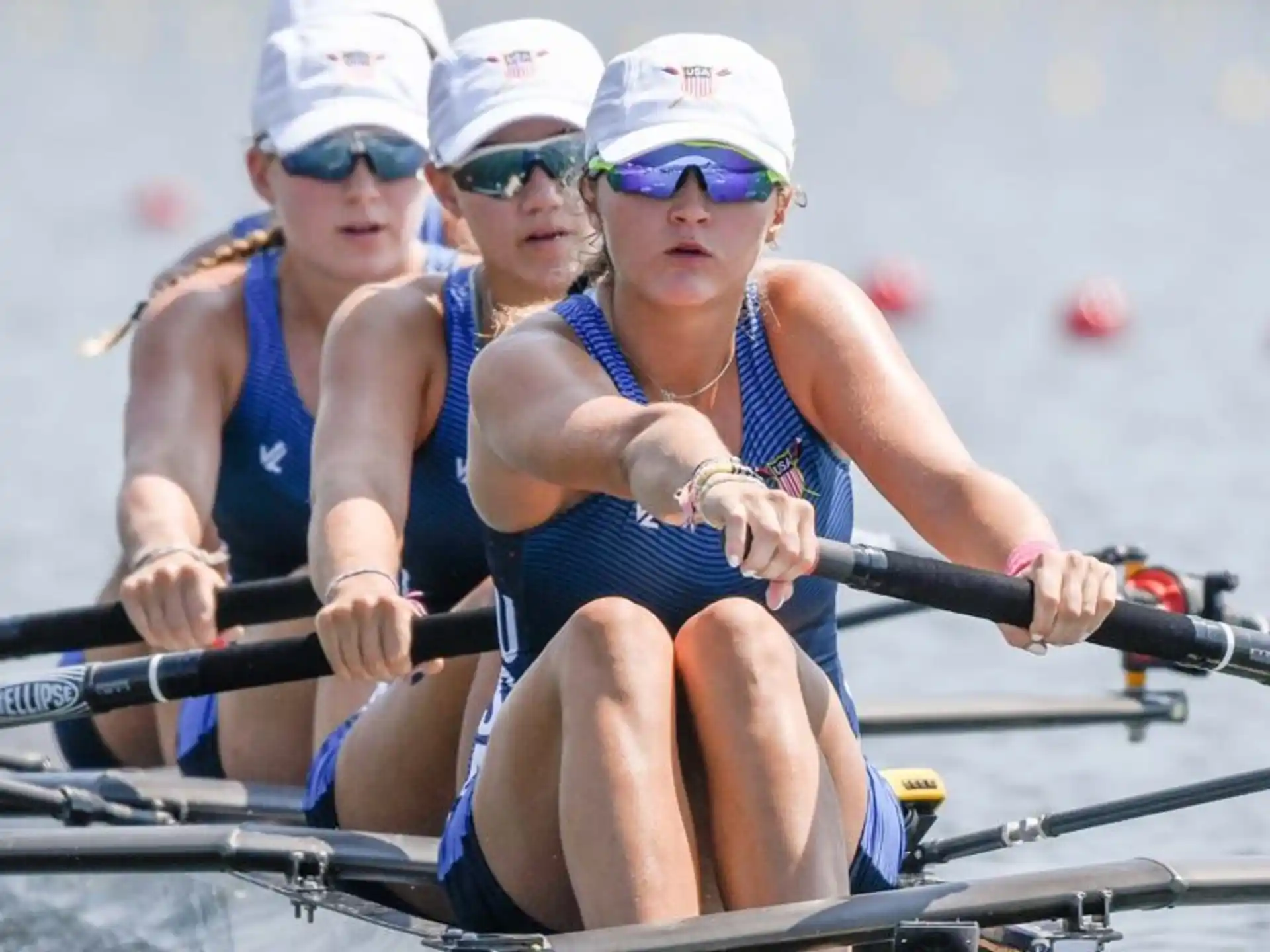 a group of women rowing a boat