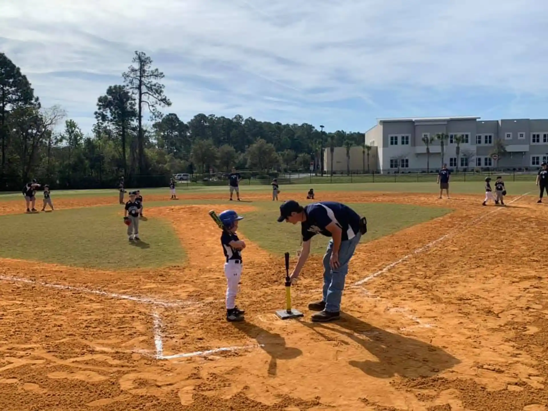 a group of people playing baseball