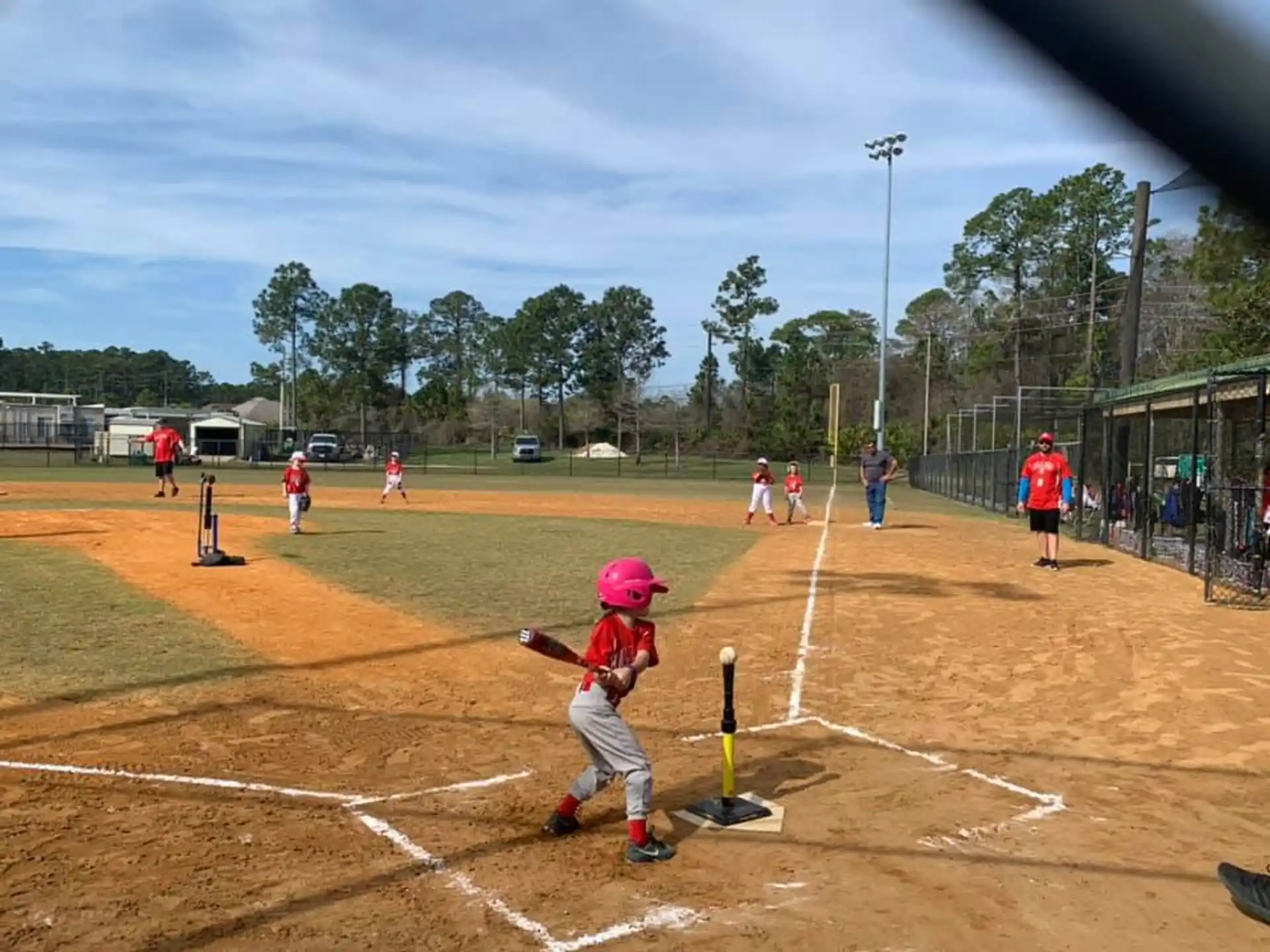 a kid swinging a baseball bat