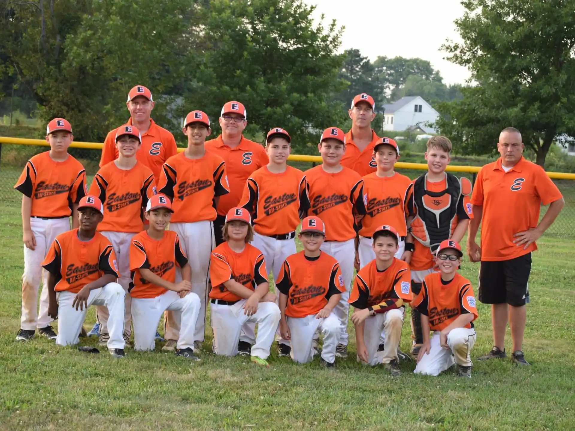a group of people in orange uniforms