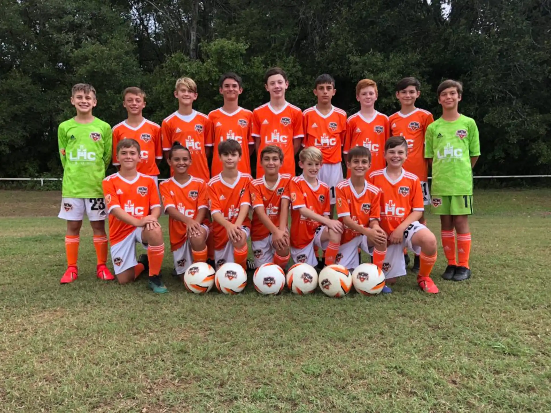 a group of football players posing for a photo