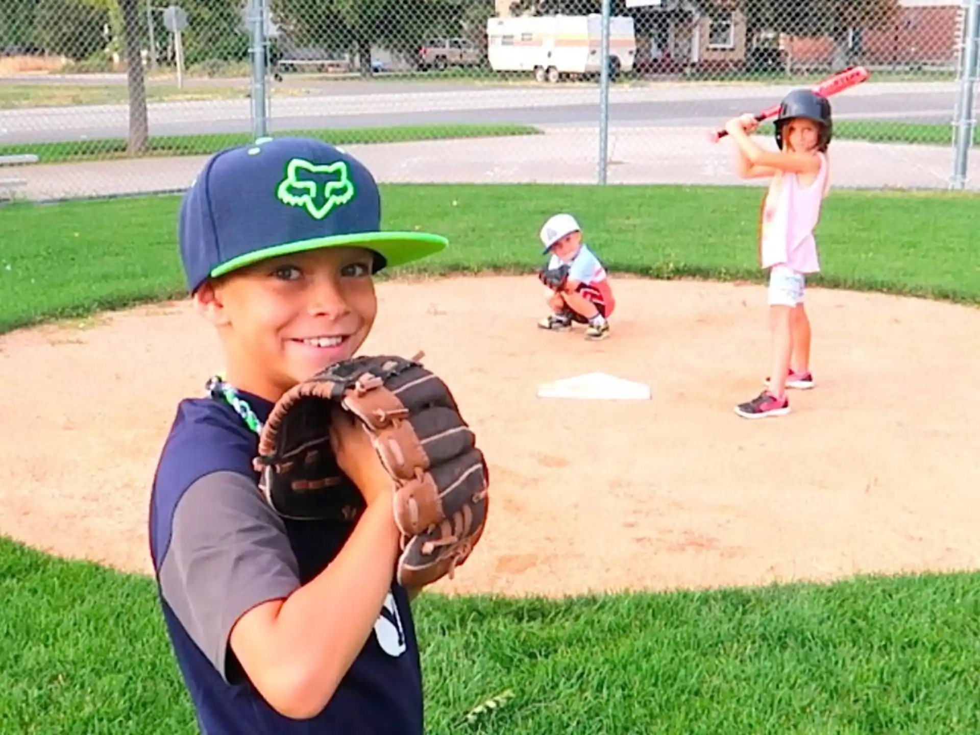 a kid in a baseball uniform