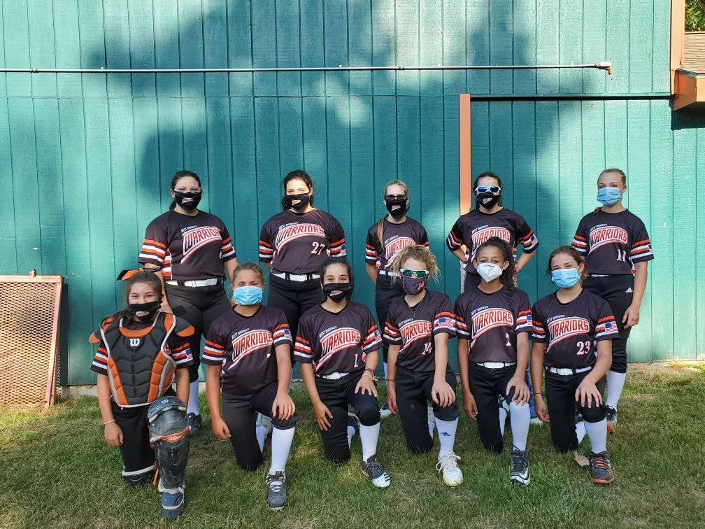 a group of people wearing helmets and posing for a photo
