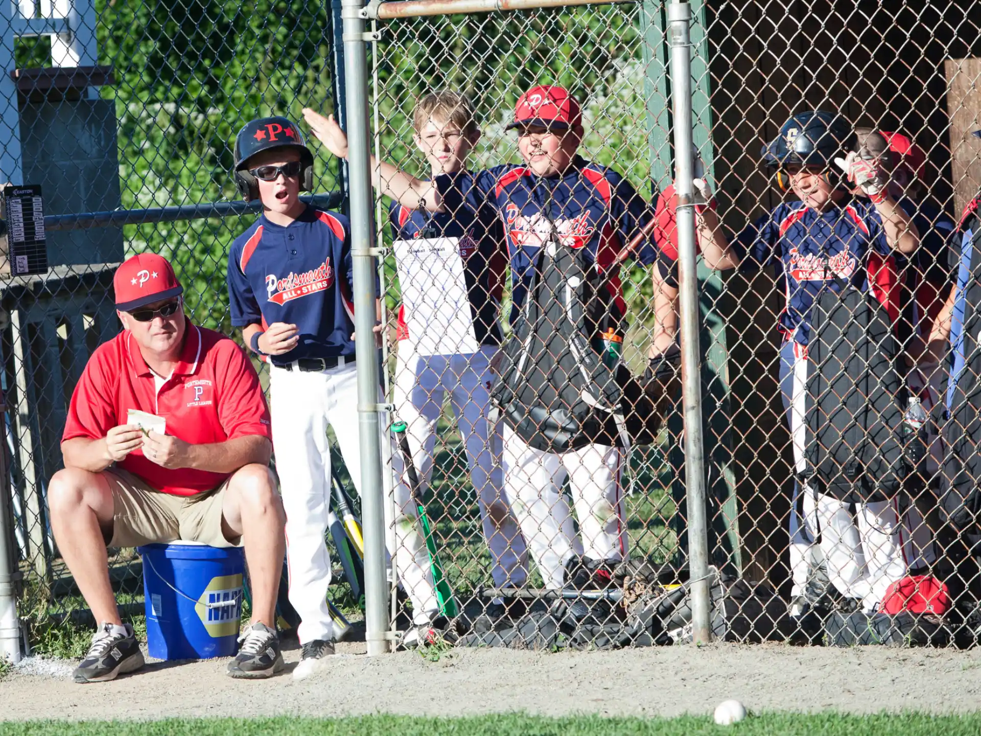 a group of people watching a baseball game