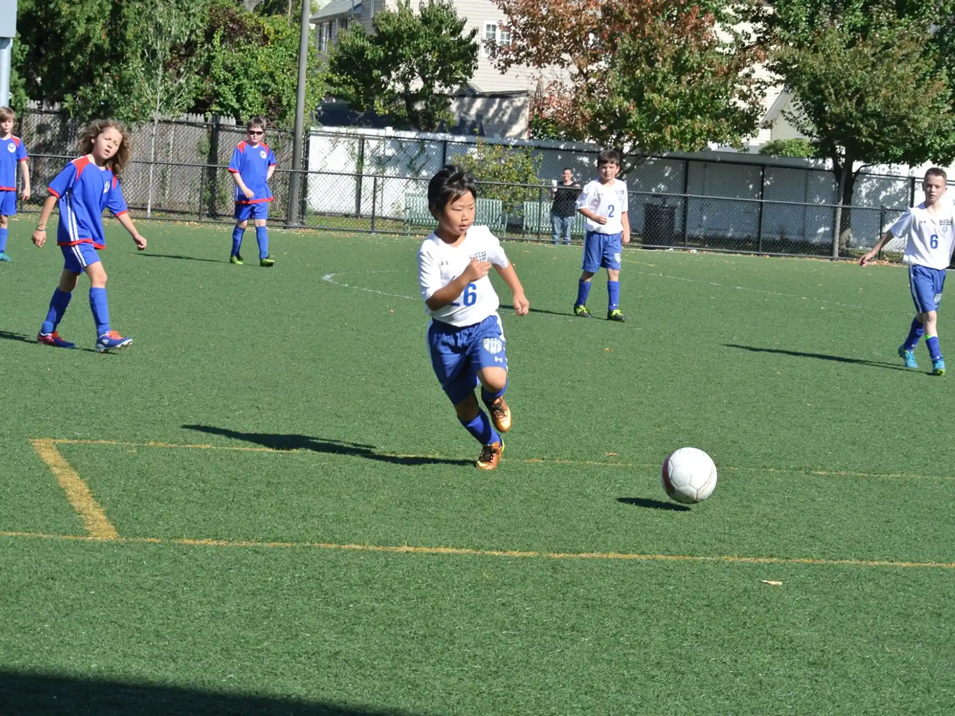 a group of kids playing football