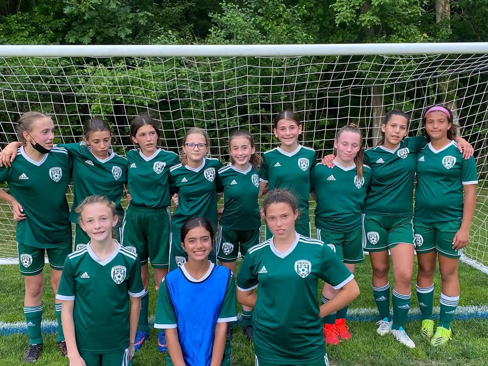 a group of girls in sports uniforms