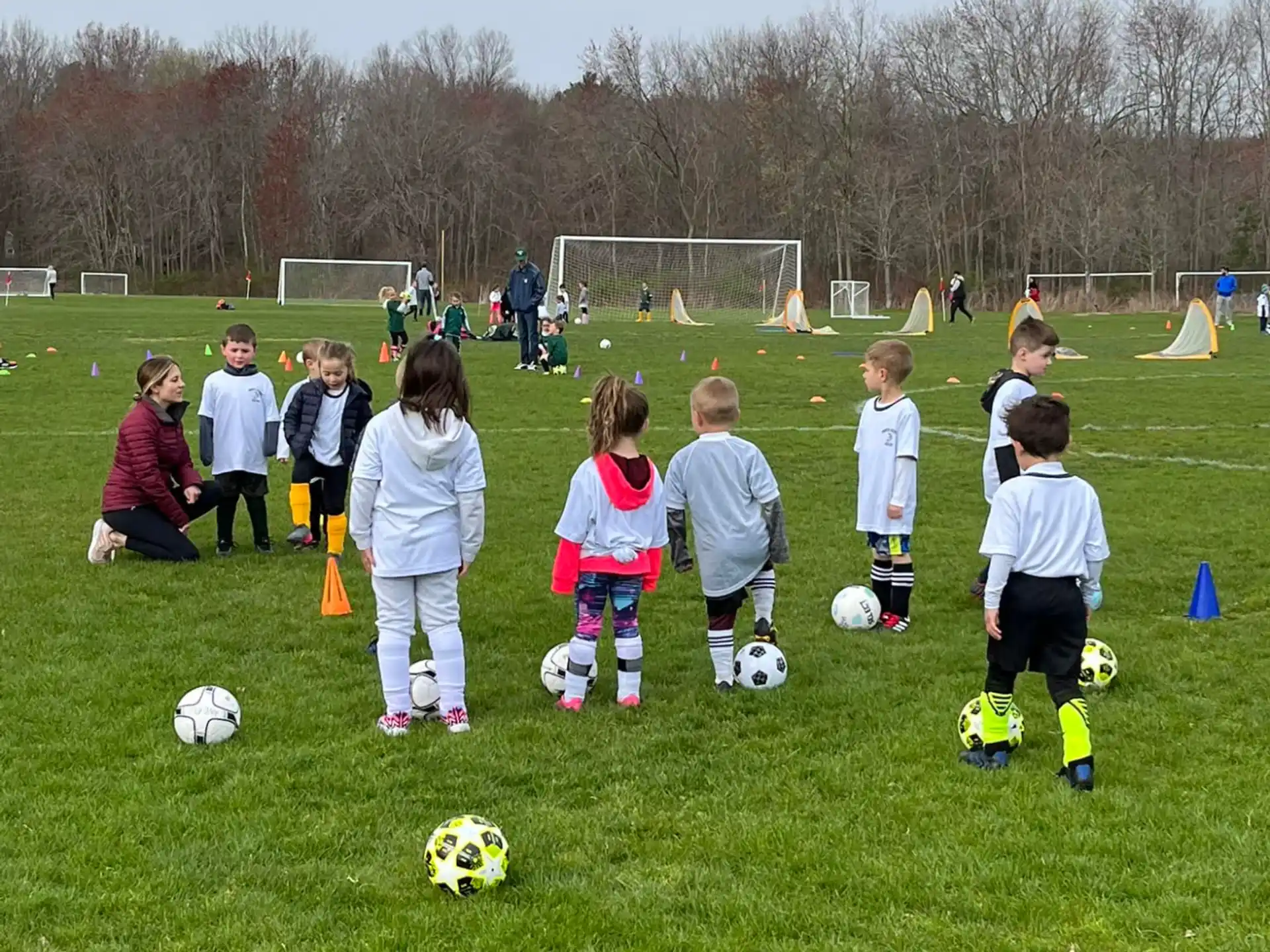 kids playing football on a field