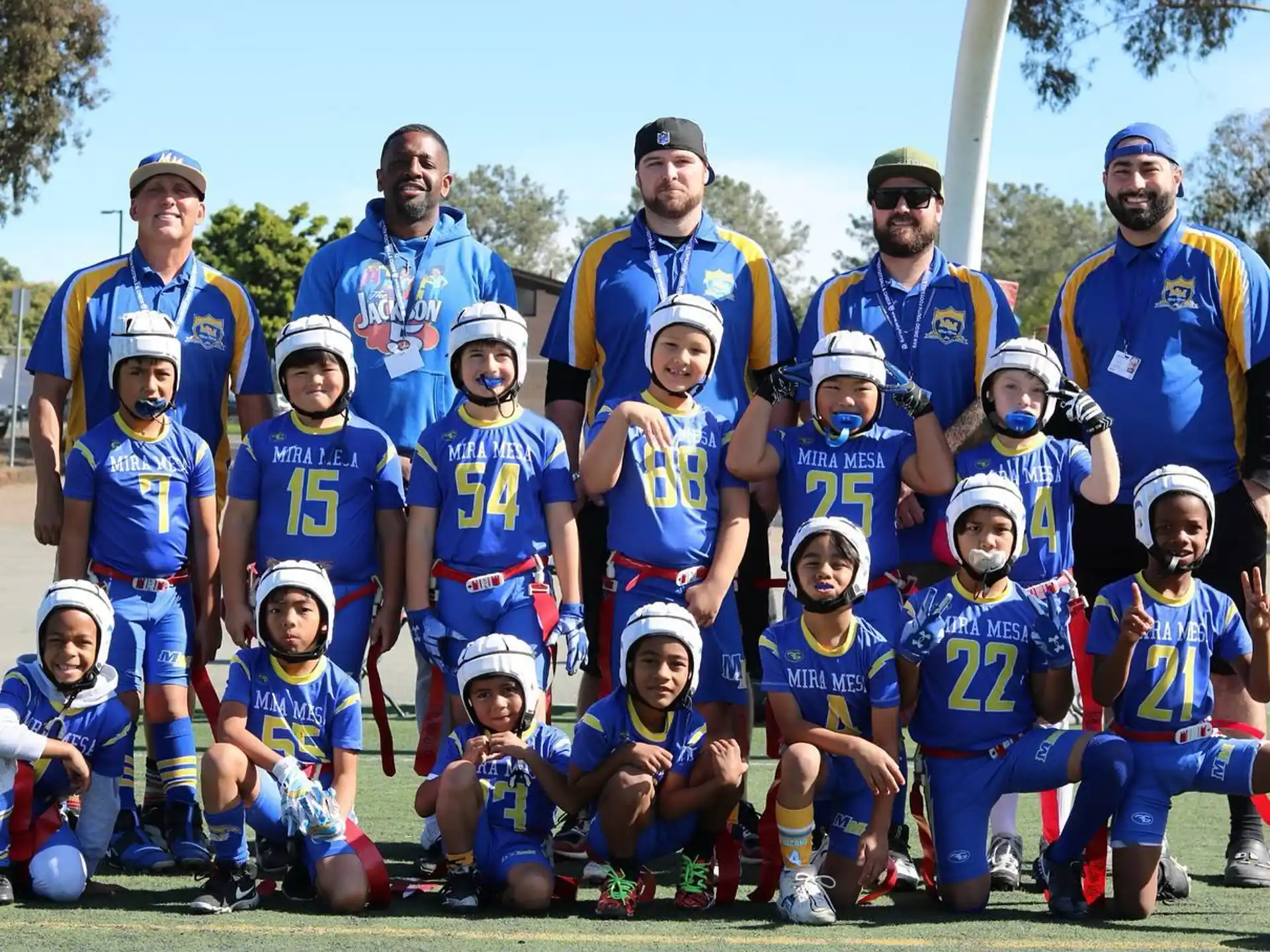 a group of people wearing blue uniforms