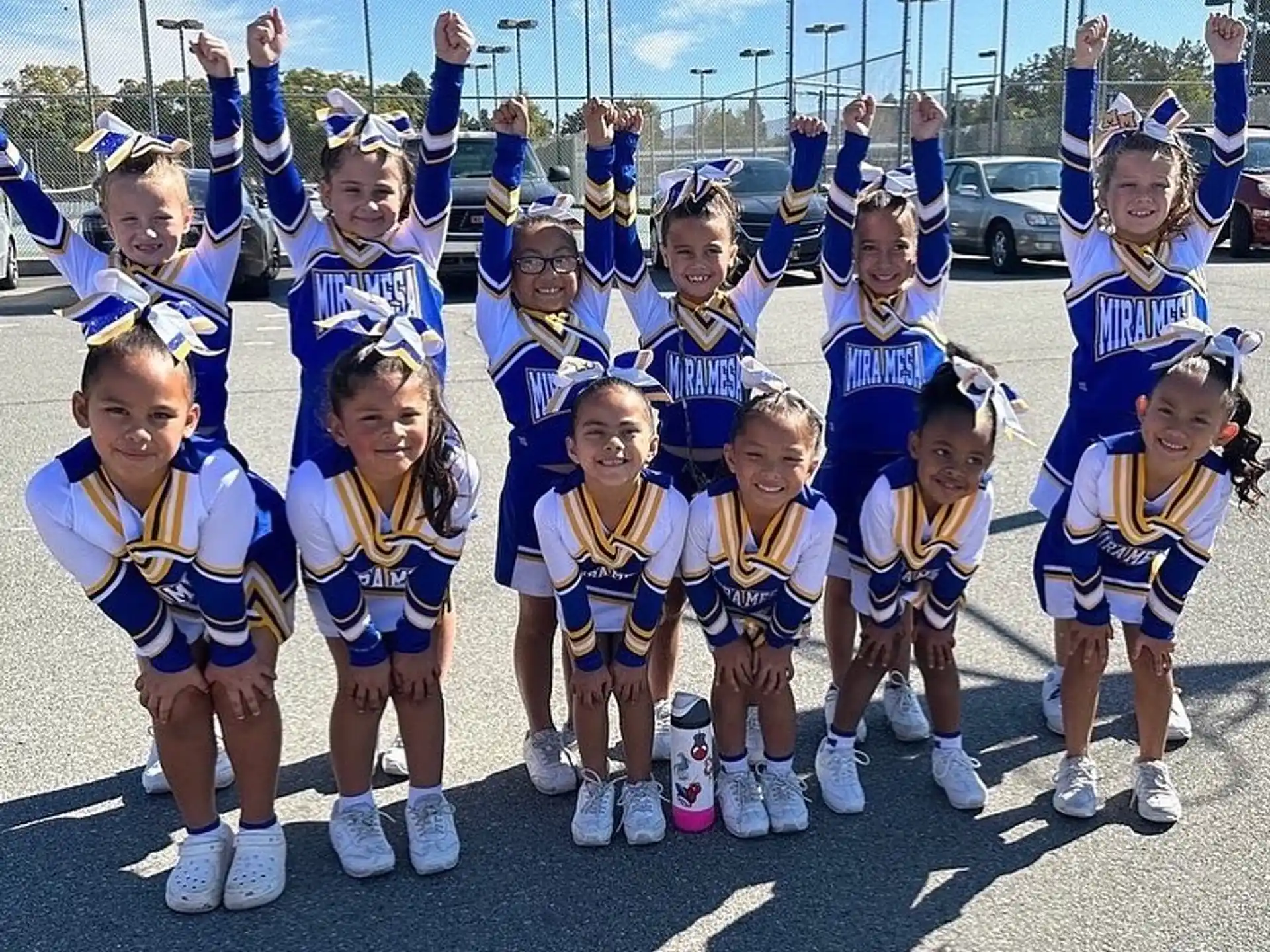 a group of people wearing matching outfits