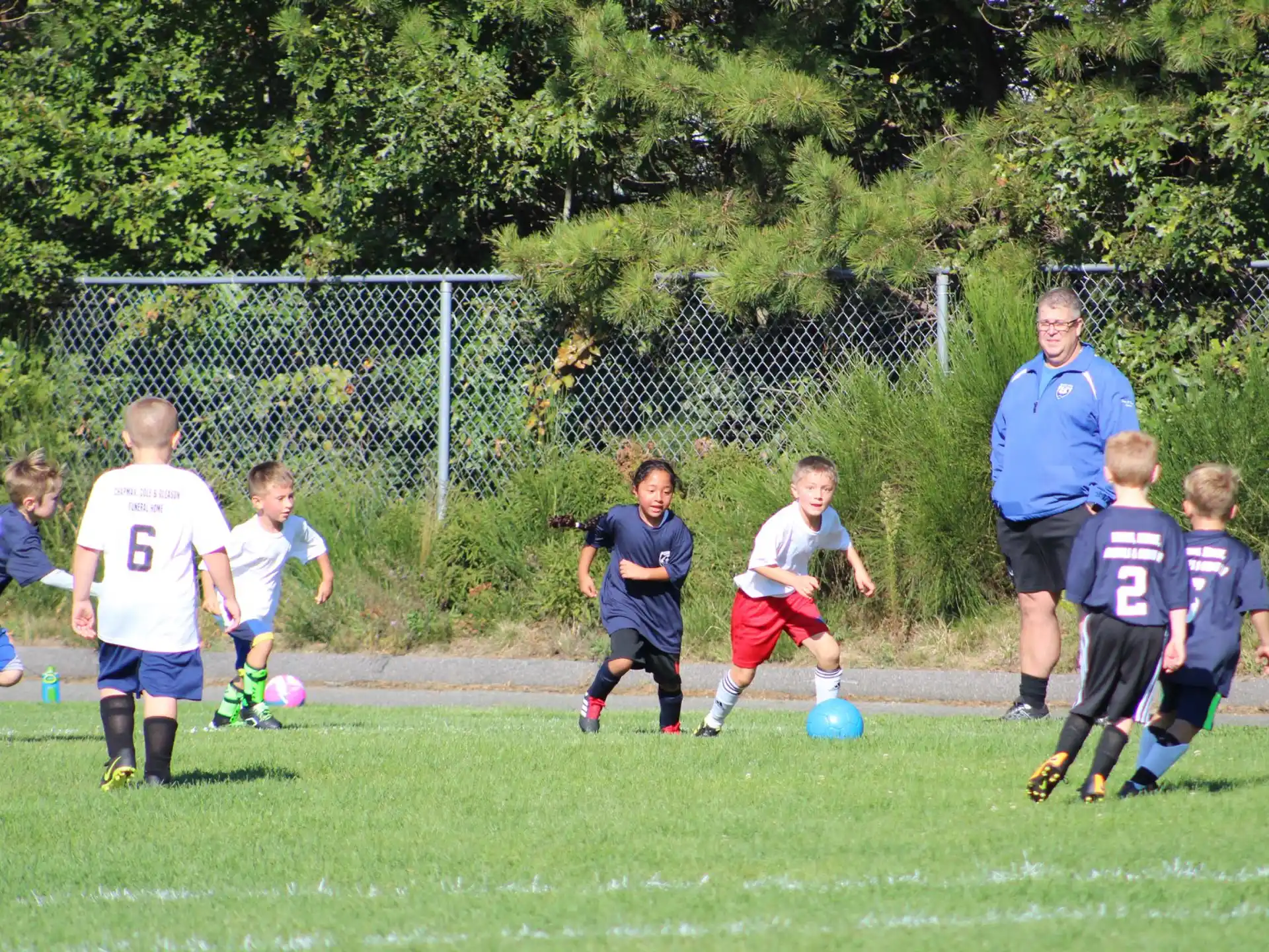 a group of kids playing football