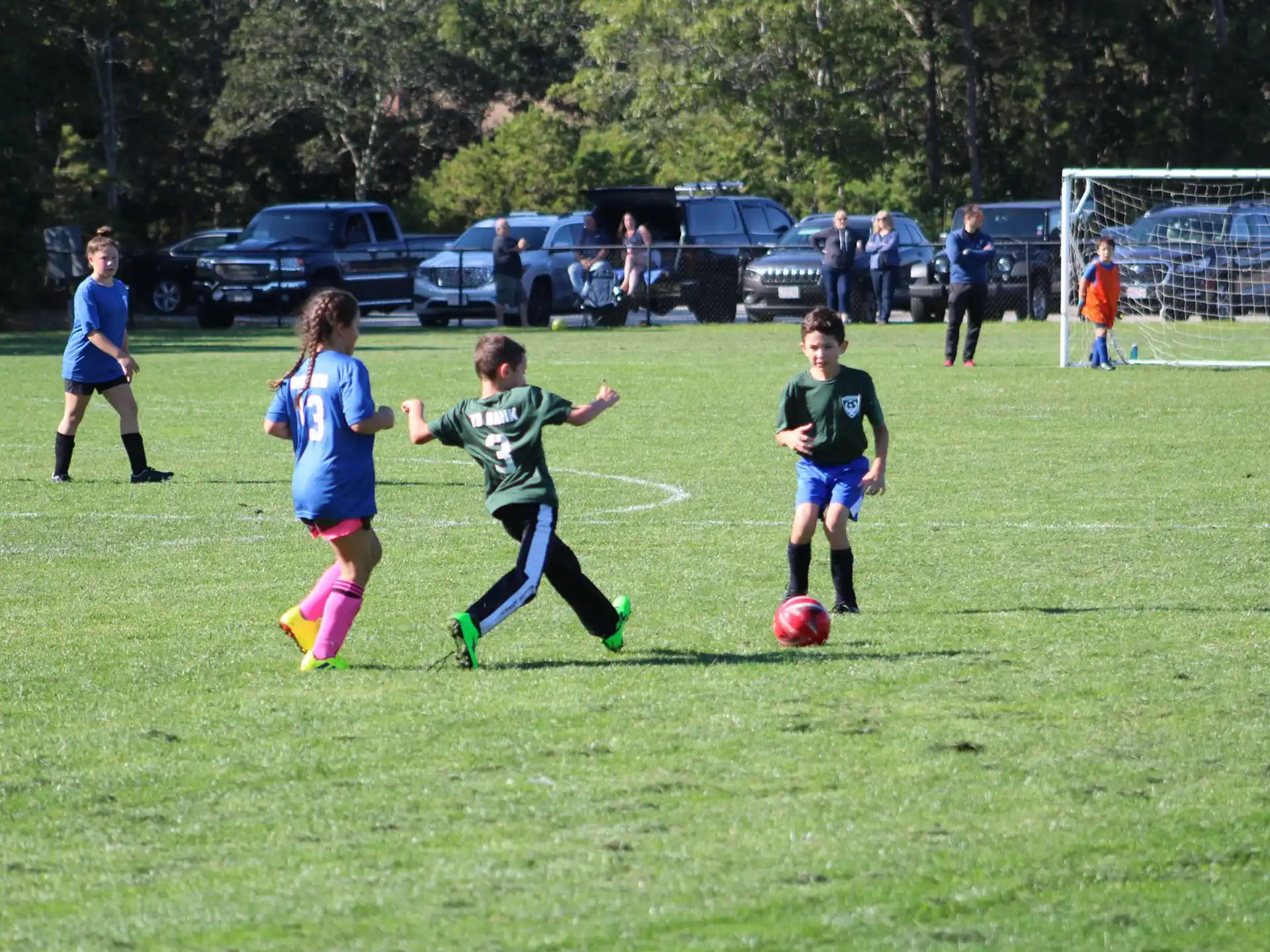 kids playing football on a field